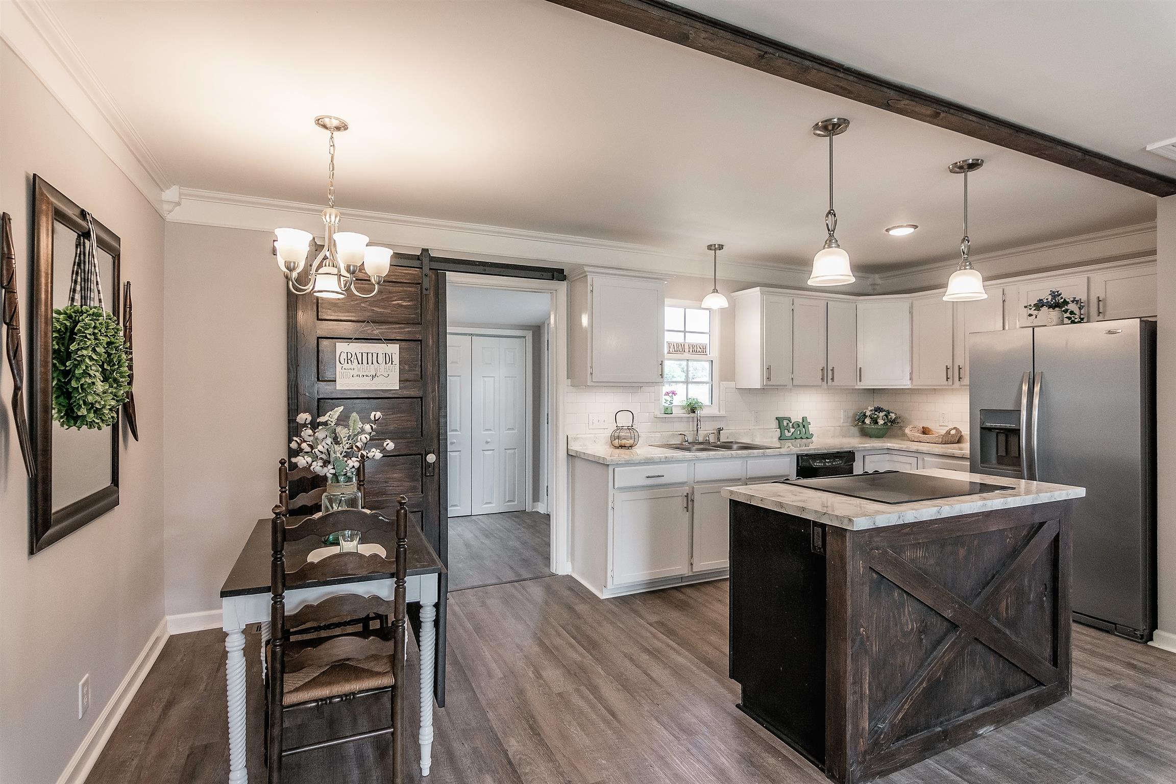 319 Airport Road Portland, TN 37148 - Photo 8 of 29 a kitchen with sink cabinets and stove