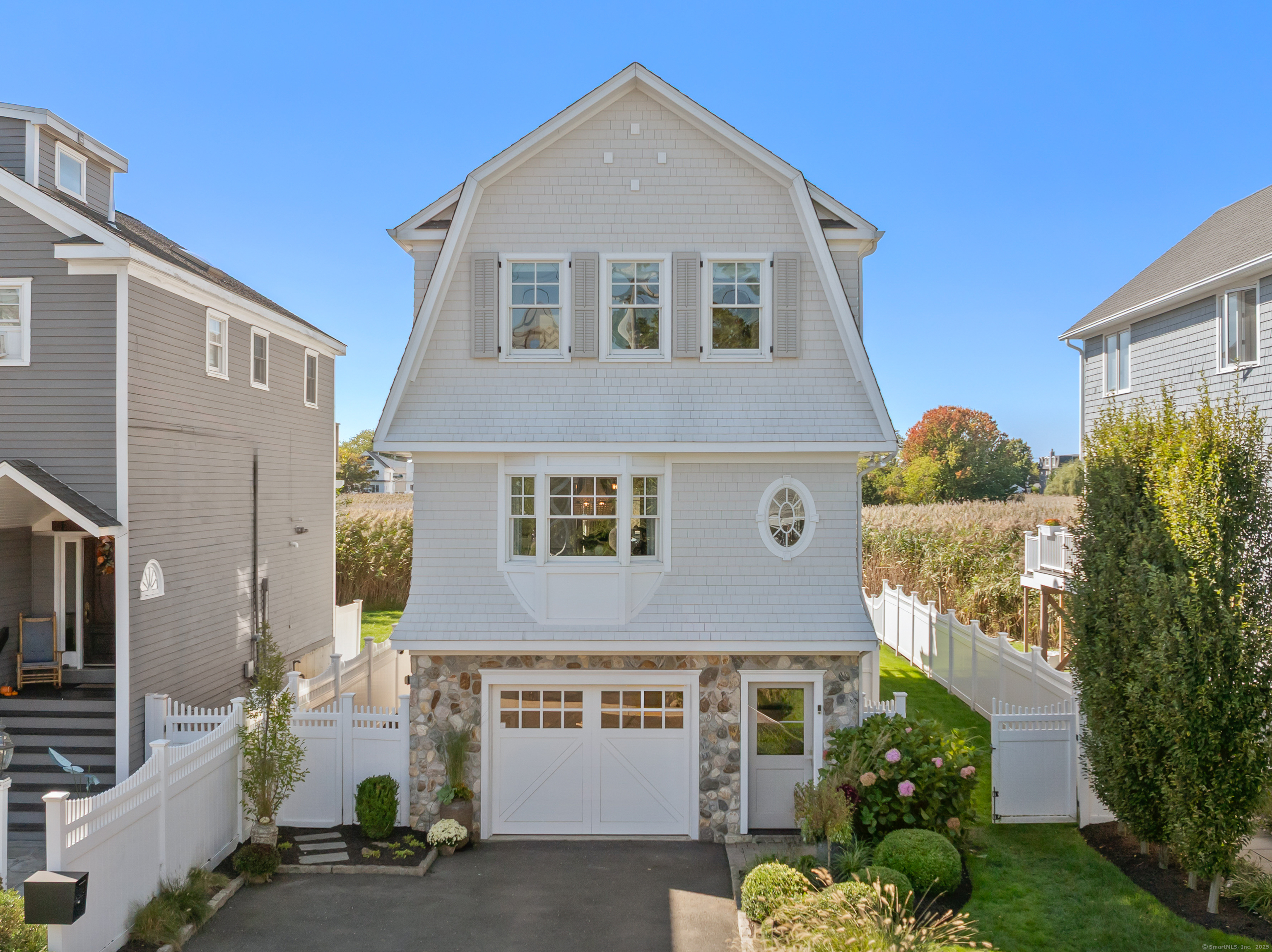 748 Rowland Road Fairfield, CT 06824 - Photo 1 of 38 a front view of a house with garden
