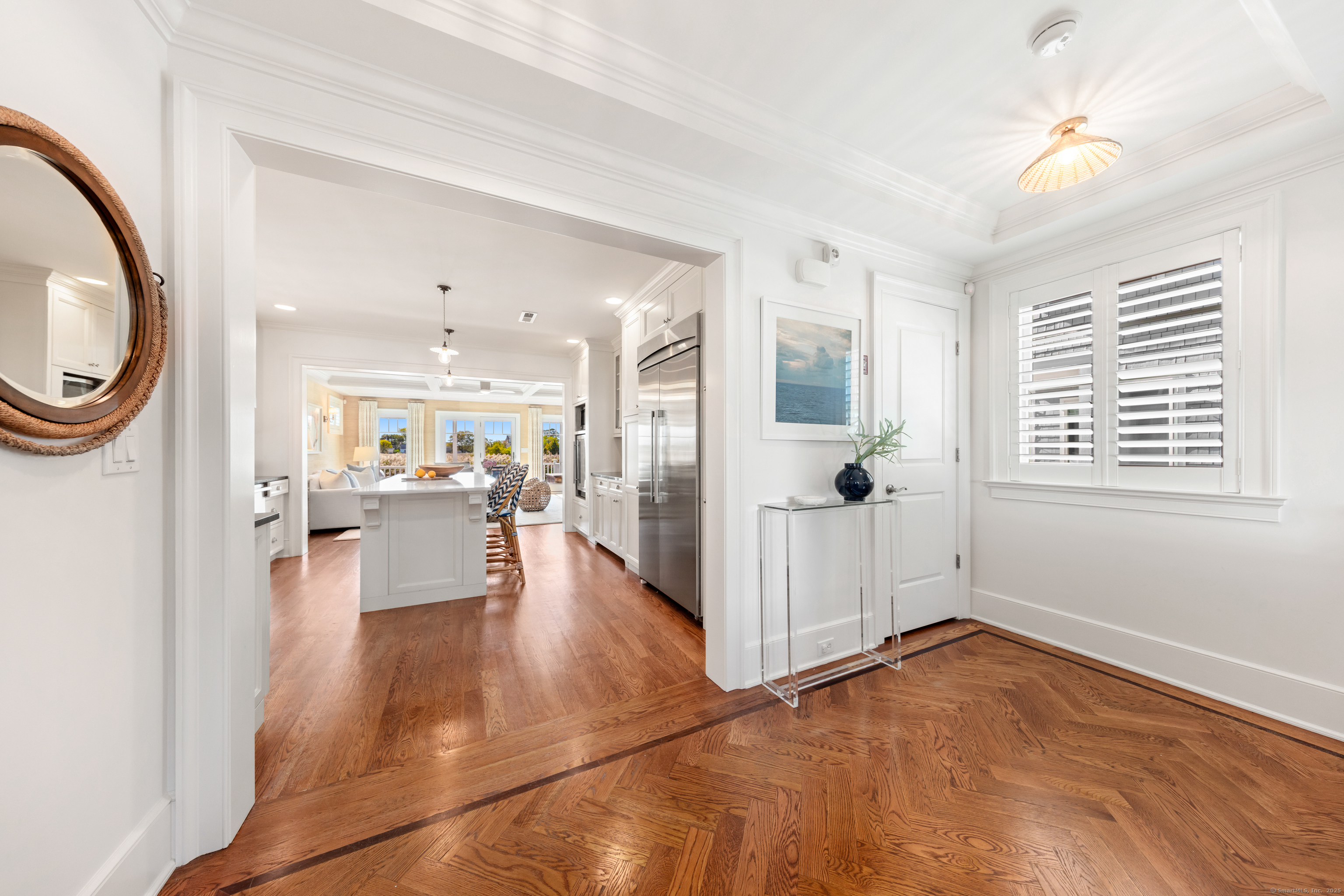 748 Rowland Road Fairfield, CT 06824 - Photo 14 of 38 a view of a living room and a window in kitchen