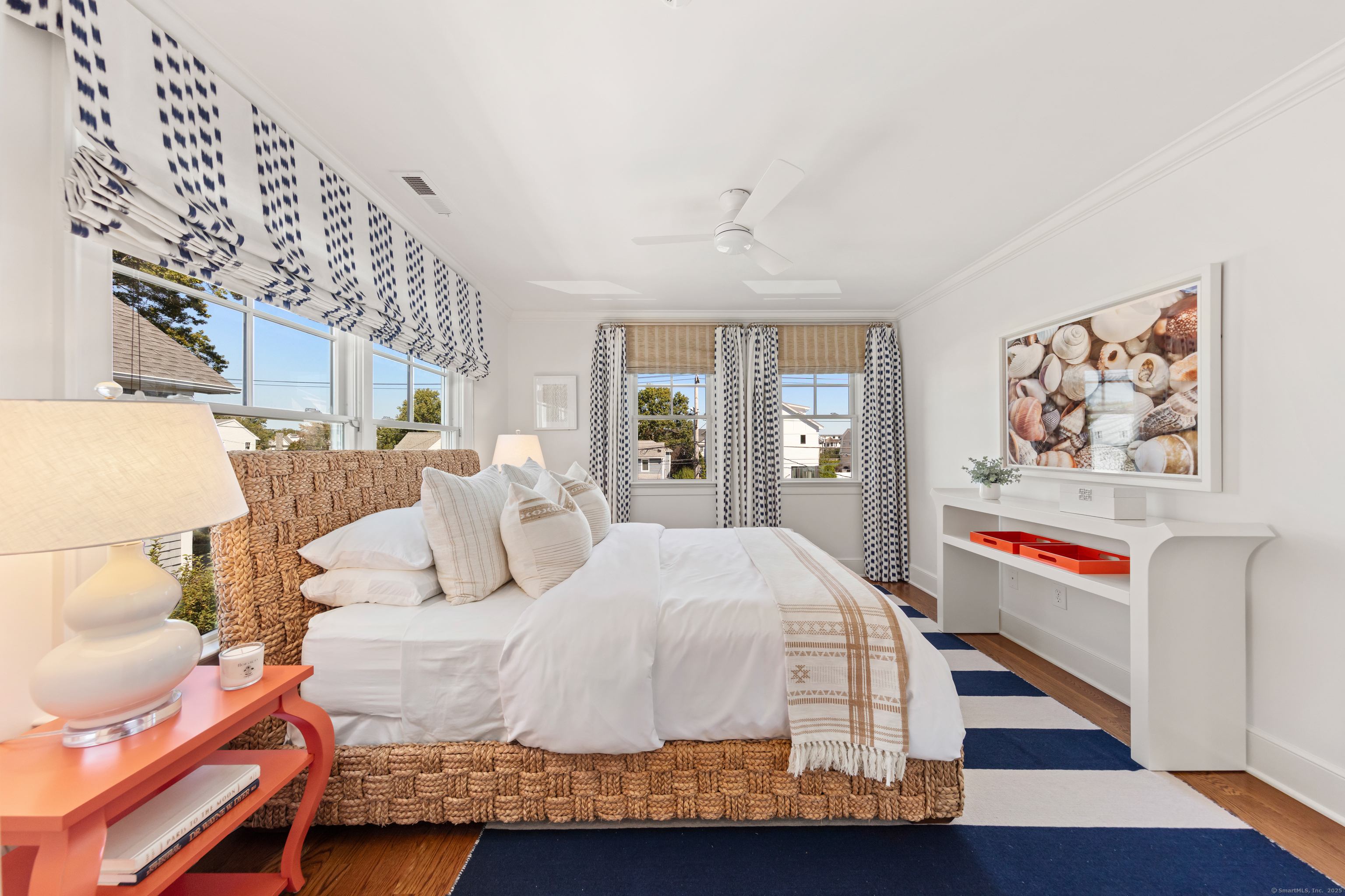 748 Rowland Road Fairfield, CT 06824 - Photo 19 of 38 a bedroom with a large bed and a painting on the wall