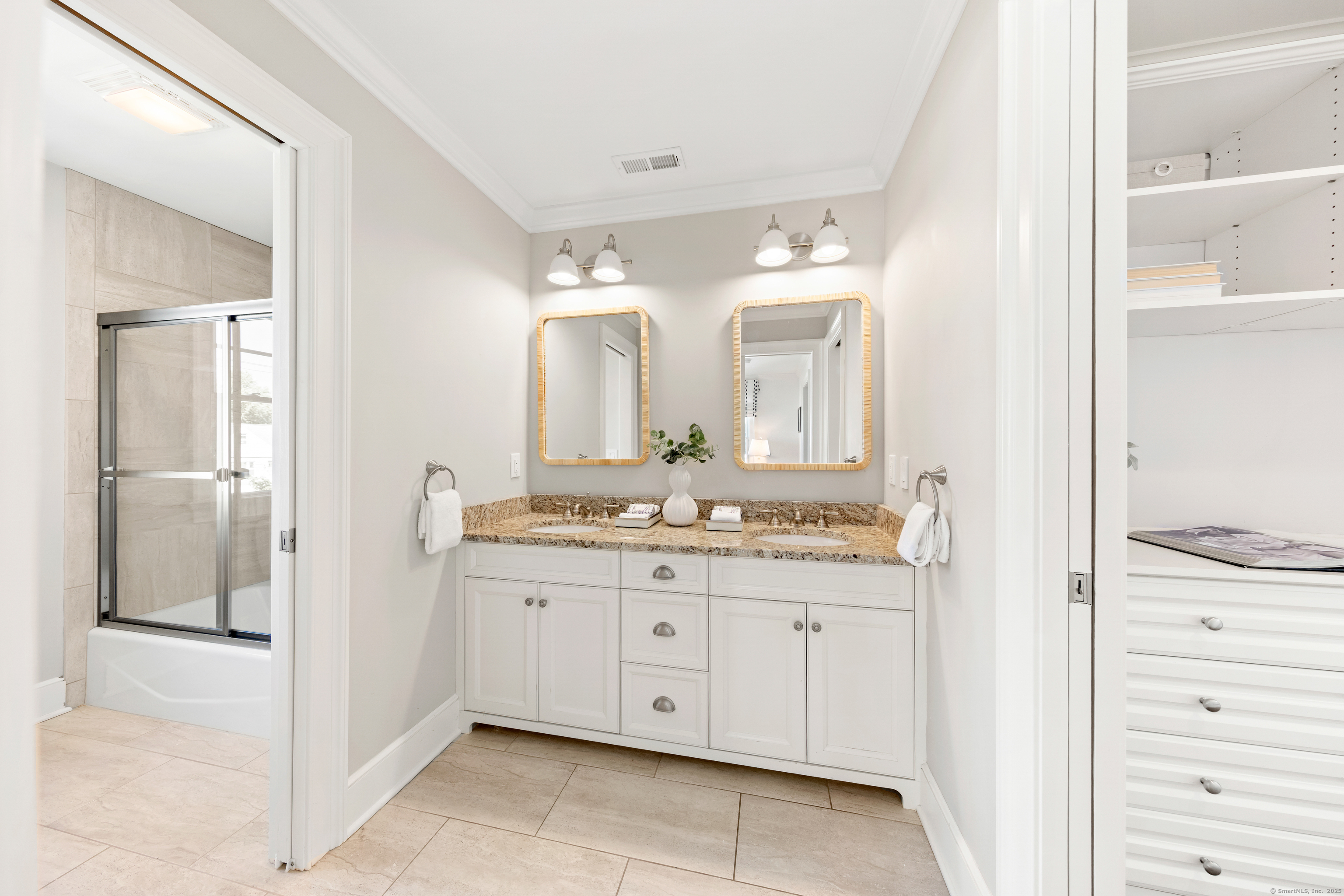 748 Rowland Road Fairfield, CT 06824 - Photo 20 of 38 a bathroom with a granite countertop sink and a mirror