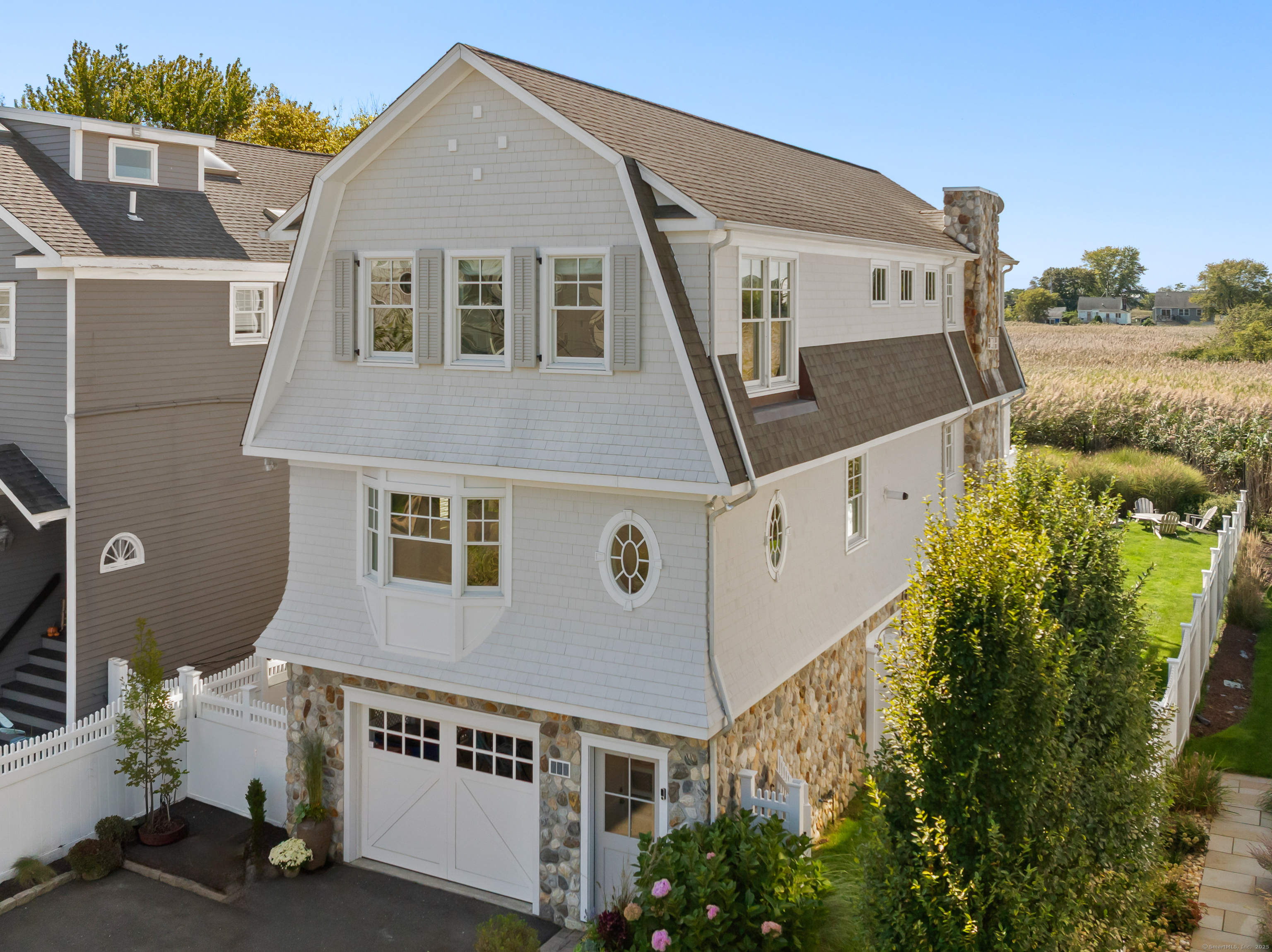 748 Rowland Road Fairfield, CT 06824 - Photo 2 of 38 a front view of a house with a yard