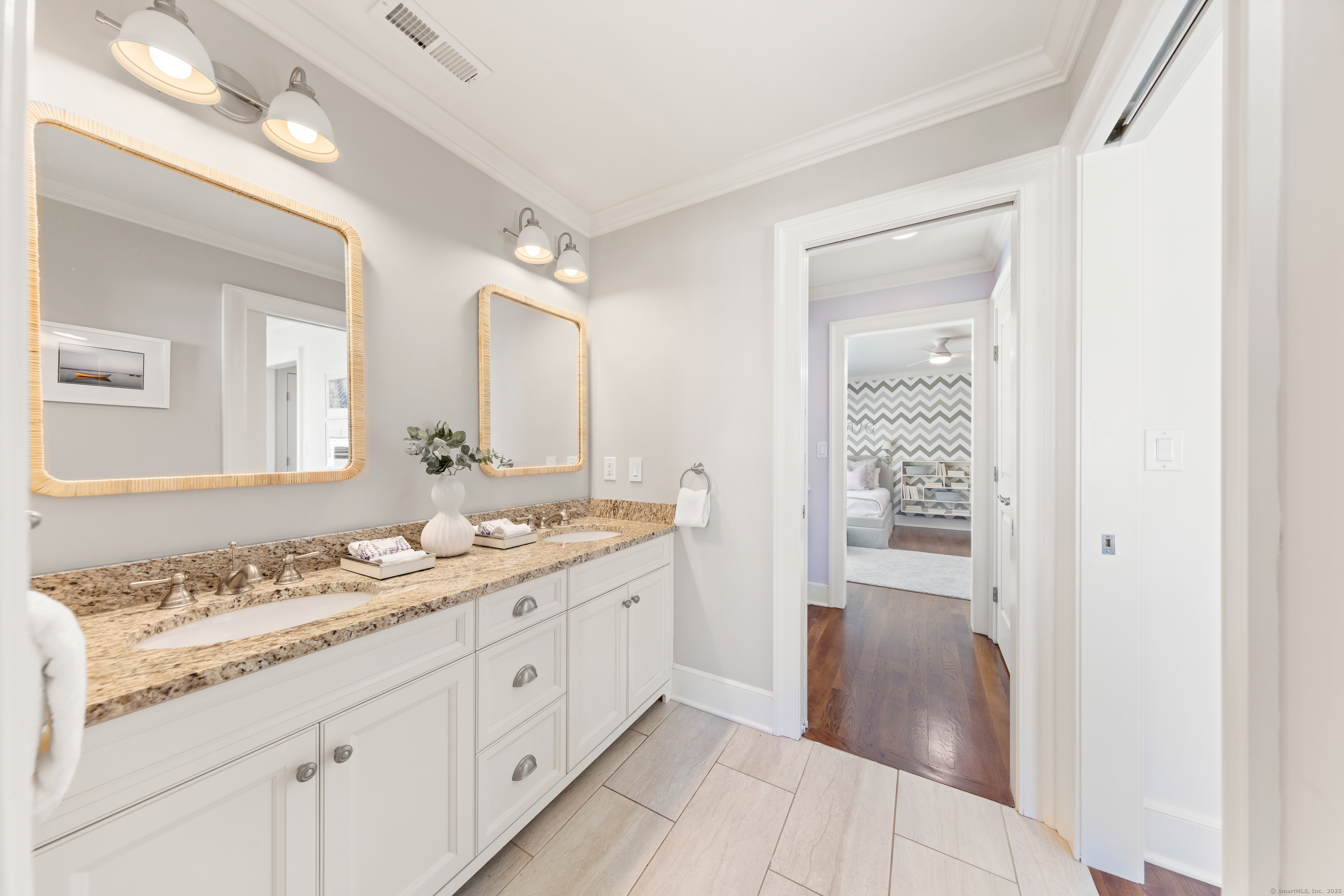 748 Rowland Road Fairfield, CT 06824 - Photo 21 of 38 a spacious bathroom with a granite countertop sink mirror and