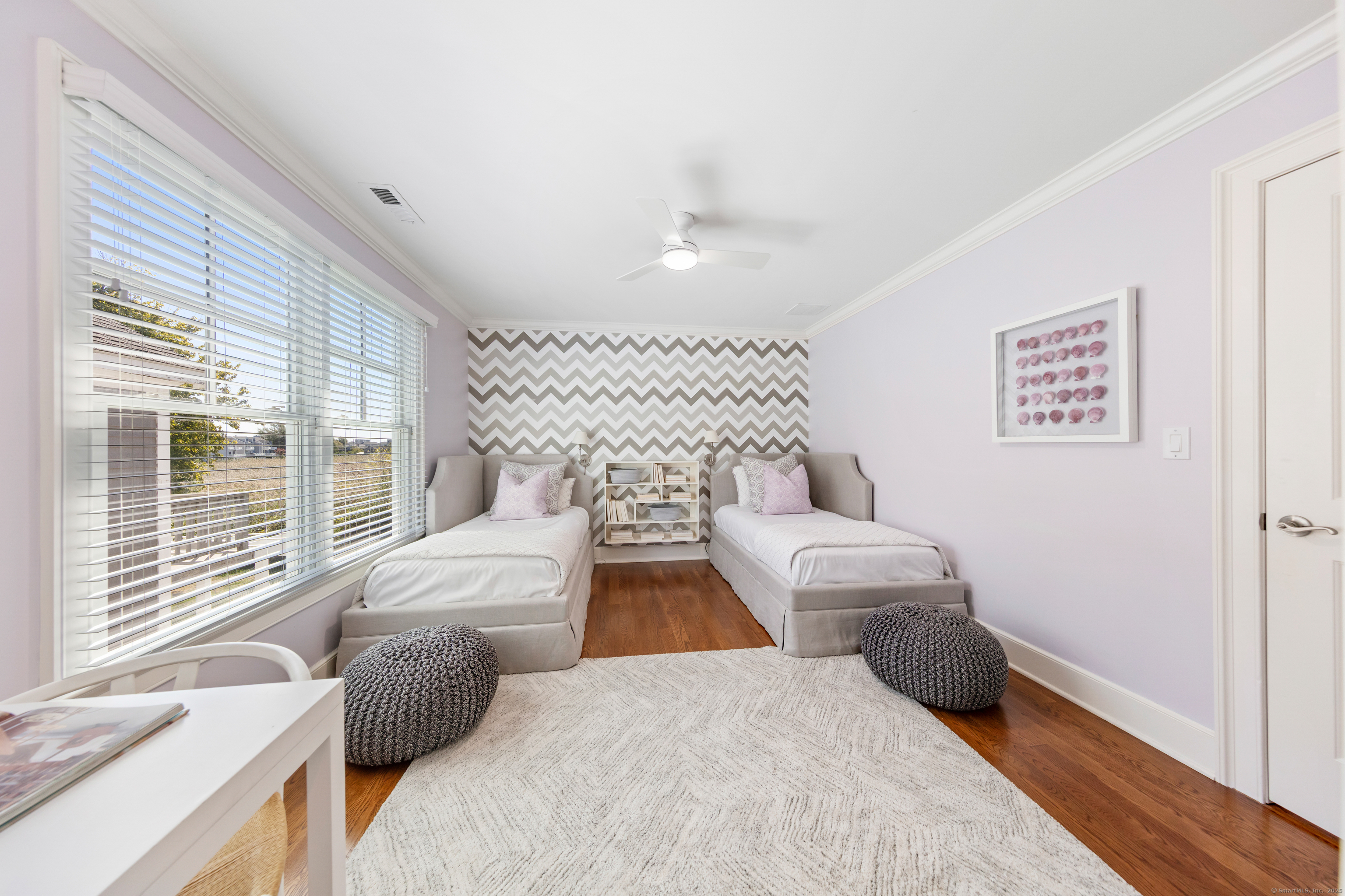 748 Rowland Road Fairfield, CT 06824 - Photo 22 of 38 a bedroom with two beds and a large window