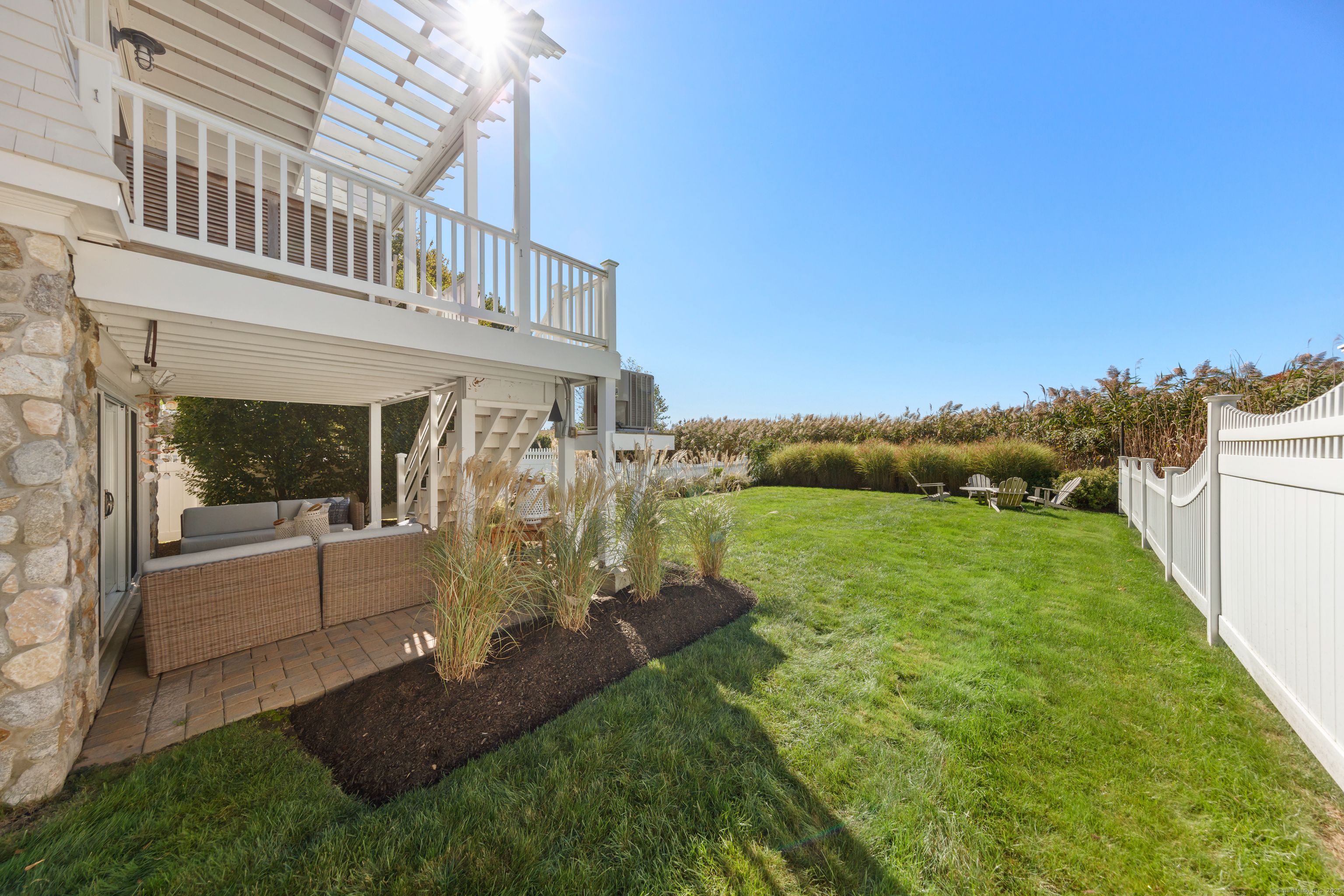 748 Rowland Road Fairfield, CT 06824 - Photo 28 of 38 a view of a house with a yard