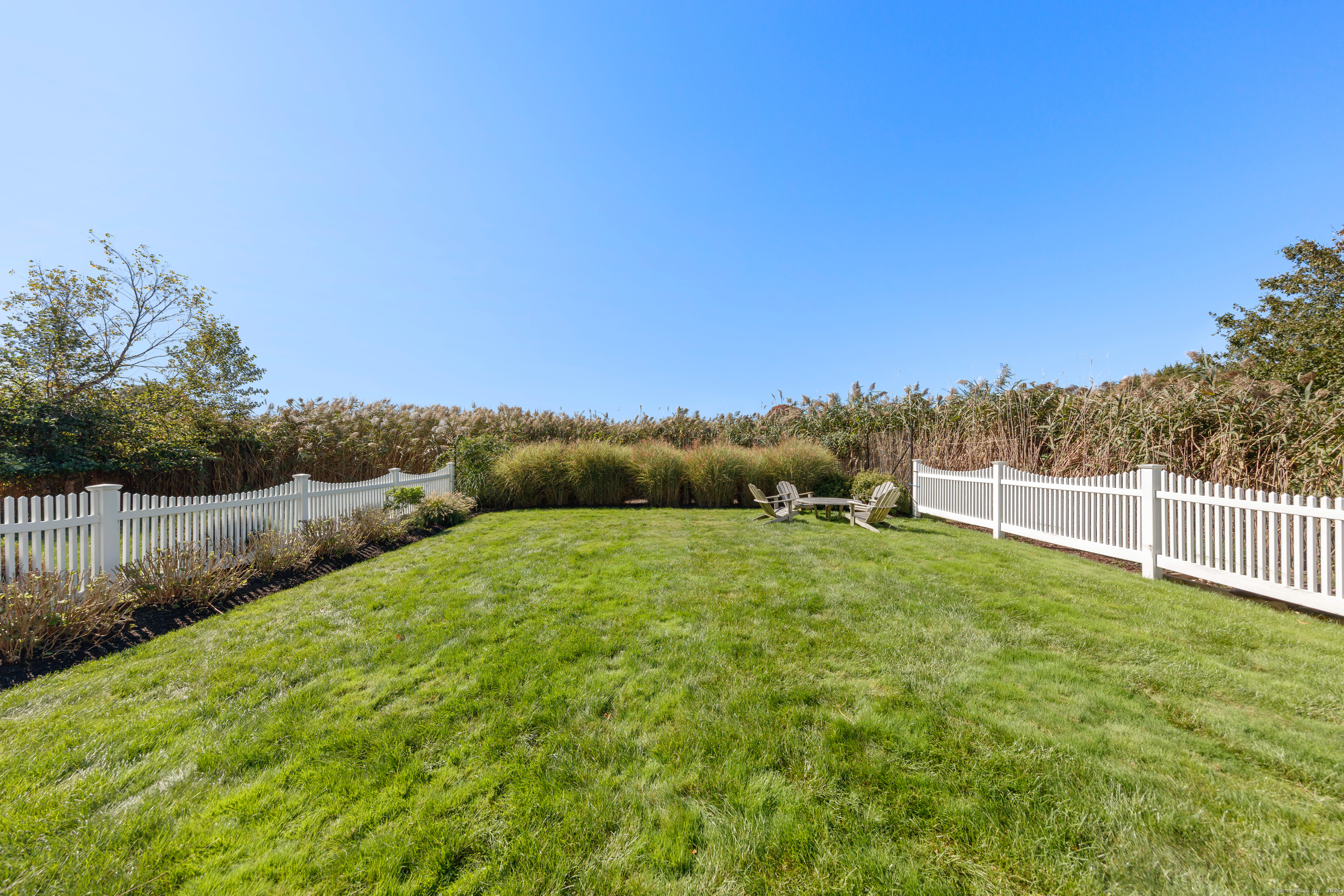 748 Rowland Road Fairfield, CT 06824 - Photo 29 of 38 a view of a yard with an outdoor space