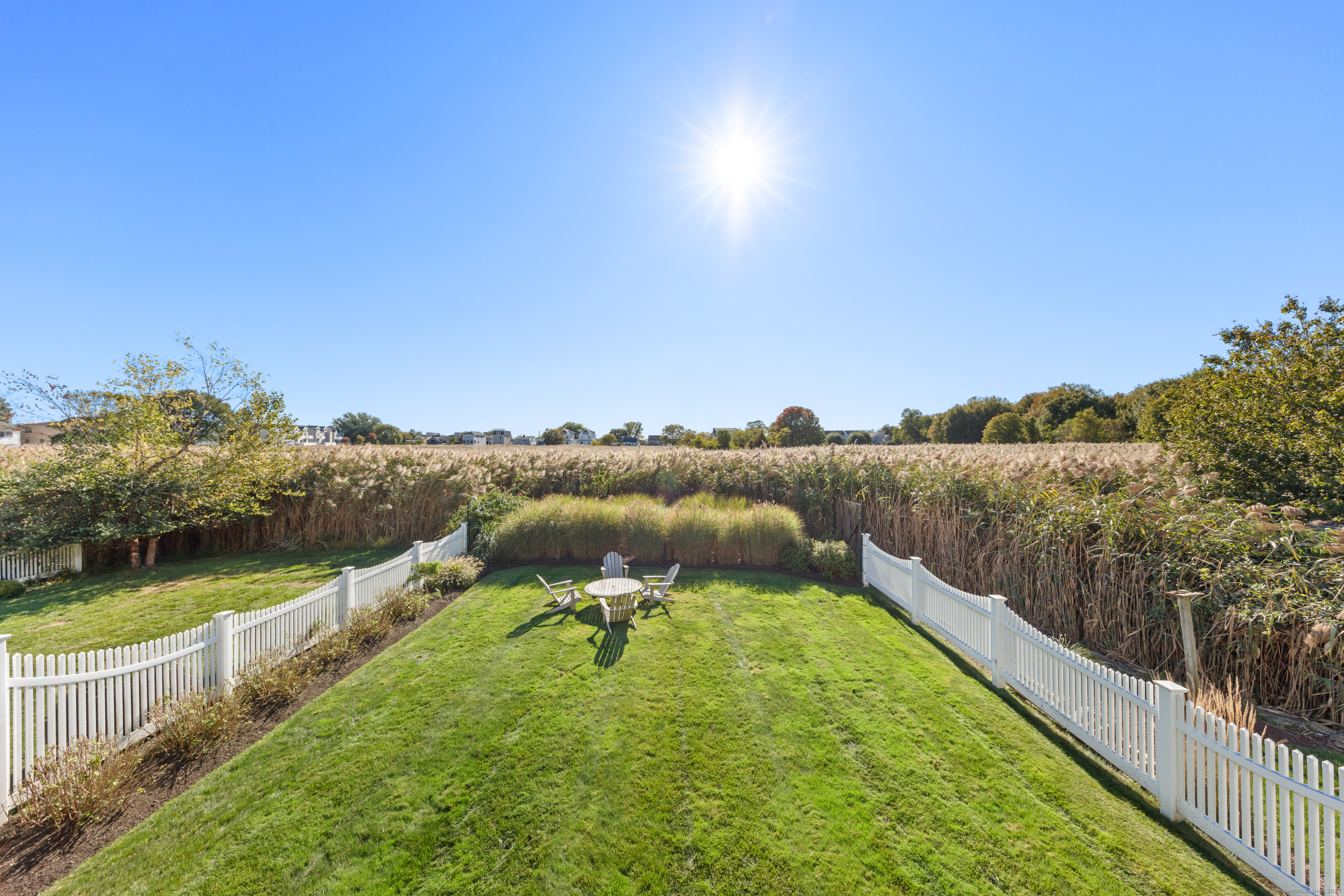 748 Rowland Road Fairfield, CT 06824 - Photo 30 of 38 a view of a lake with houses in the back