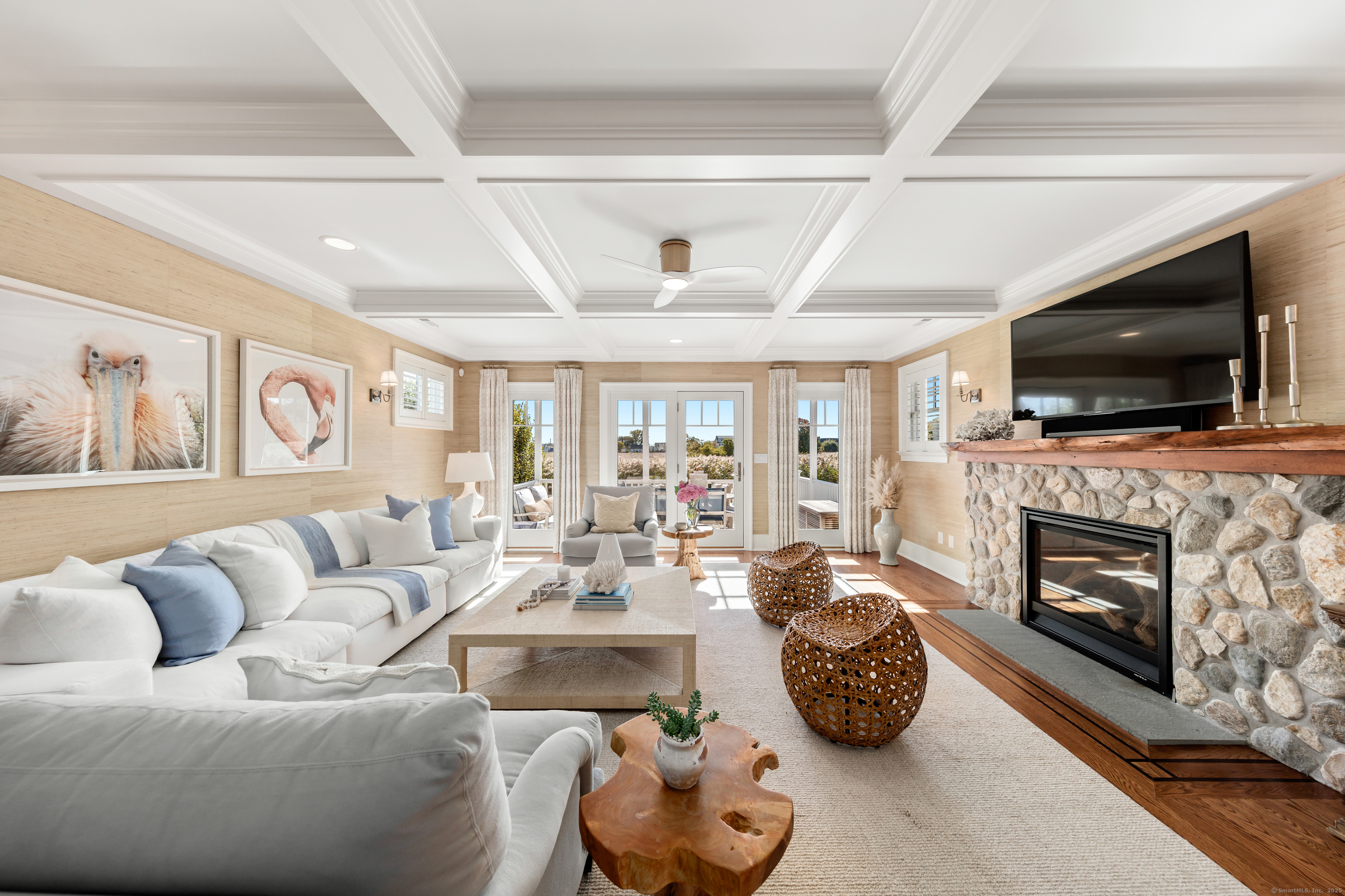 748 Rowland Road Fairfield, CT 06824 - Photo 3 of 38 a living room with fireplace furniture and a flat screen tv