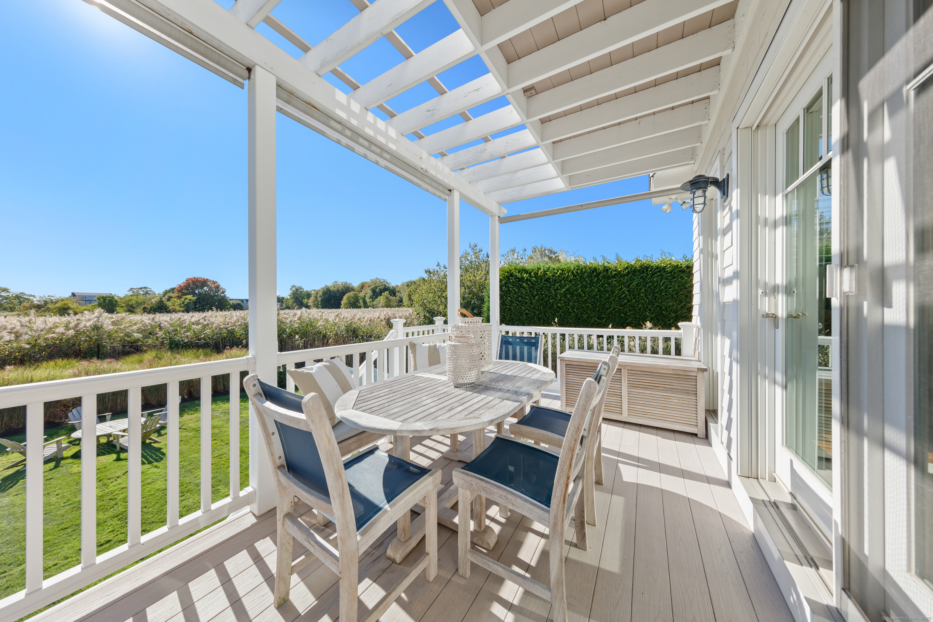 748 Rowland Road Fairfield, CT 06824 - Photo 7 of 38 a view of a patio with a table and chairs