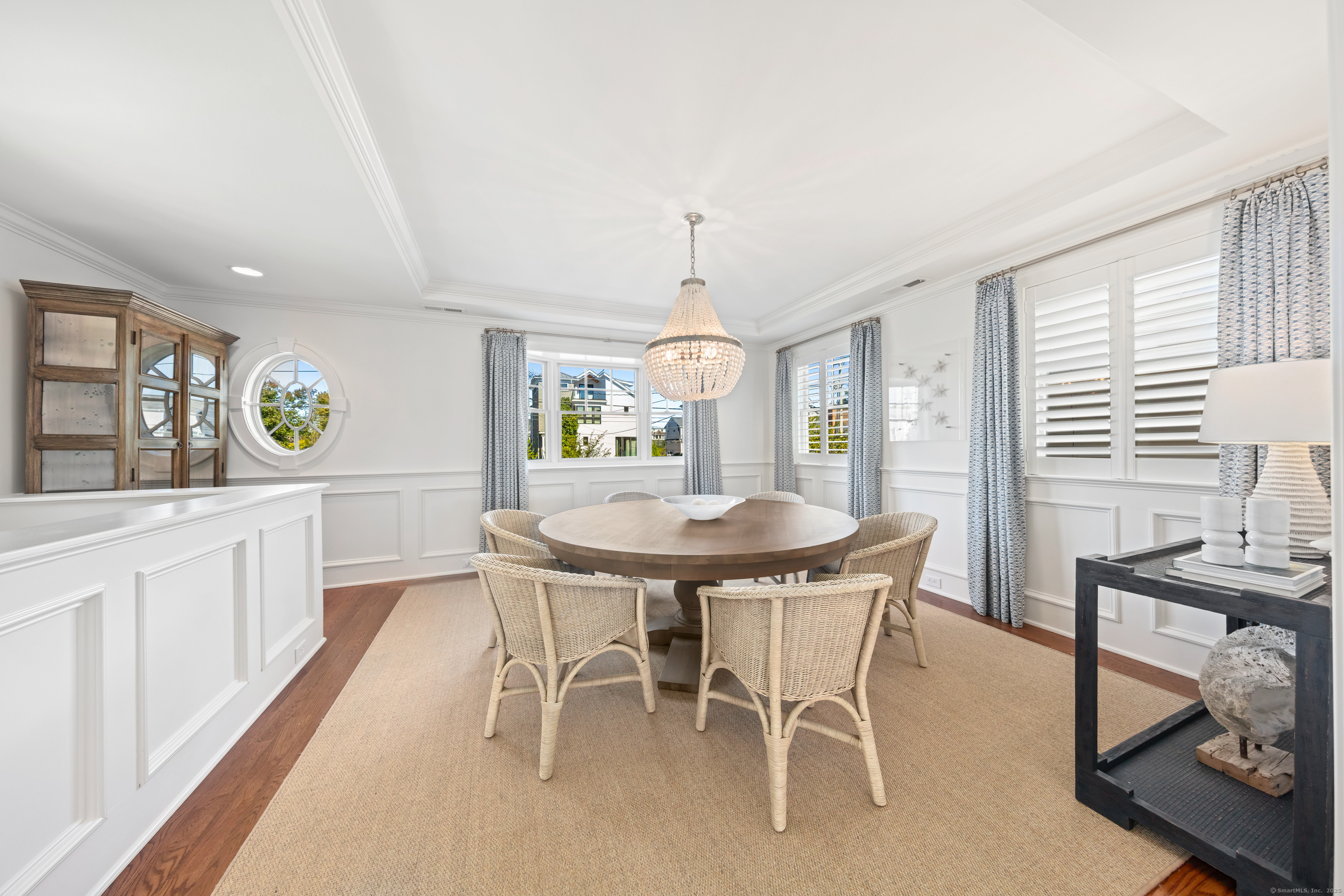 748 Rowland Road Fairfield, CT 06824 - Photo 8 of 38 a view of a dining room with furniture and window