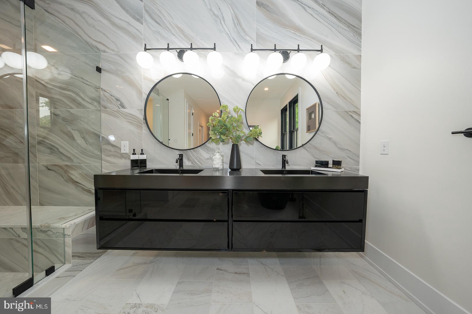187 South Spring Mill Road Villanova, PA 19085 - Photo 33 of 53 a bathroom with a sink and a mirror