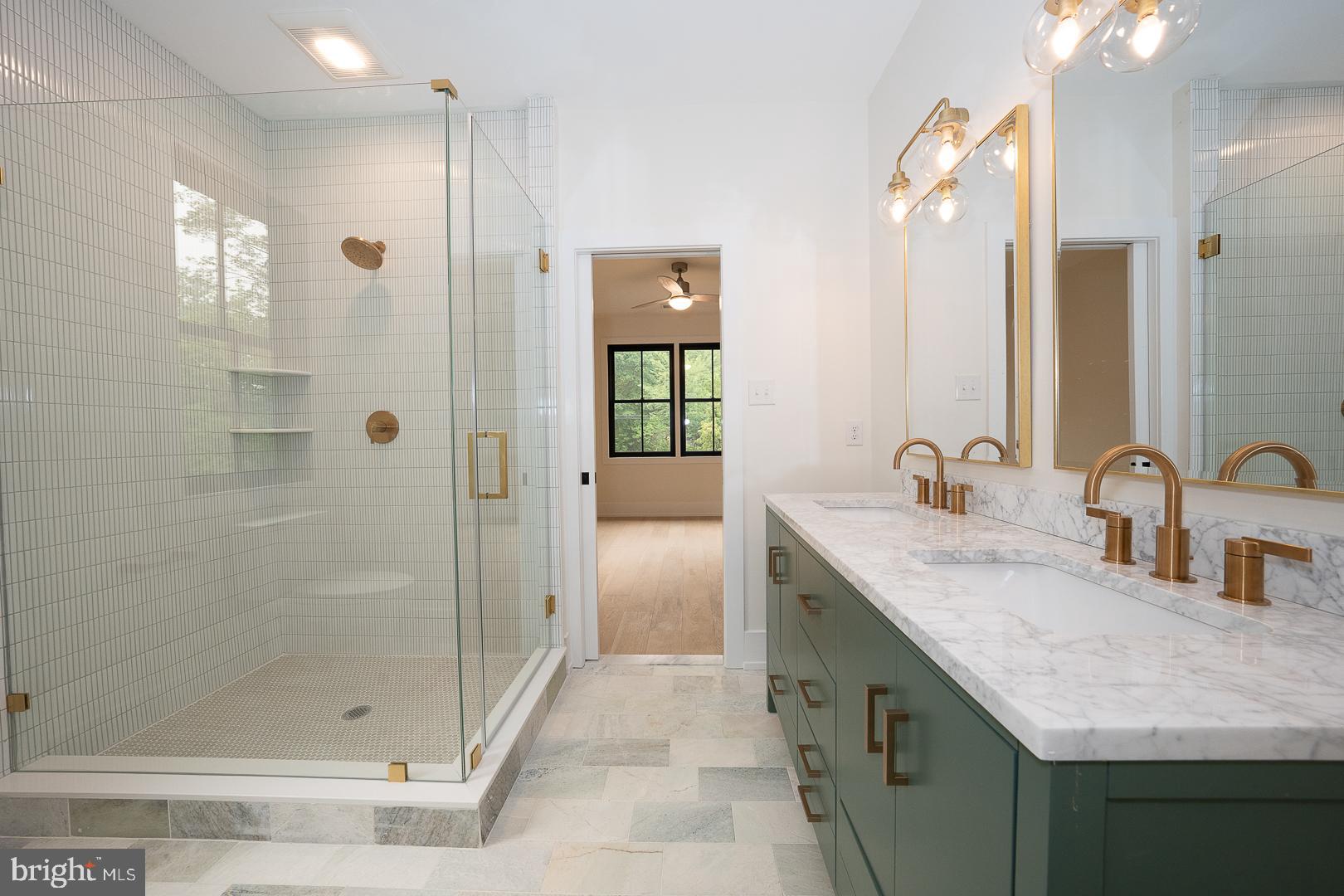 187 South Spring Mill Road Villanova, PA 19085 - Photo 43 of 53 a bathroom with a granite countertop sink shower and a mirror