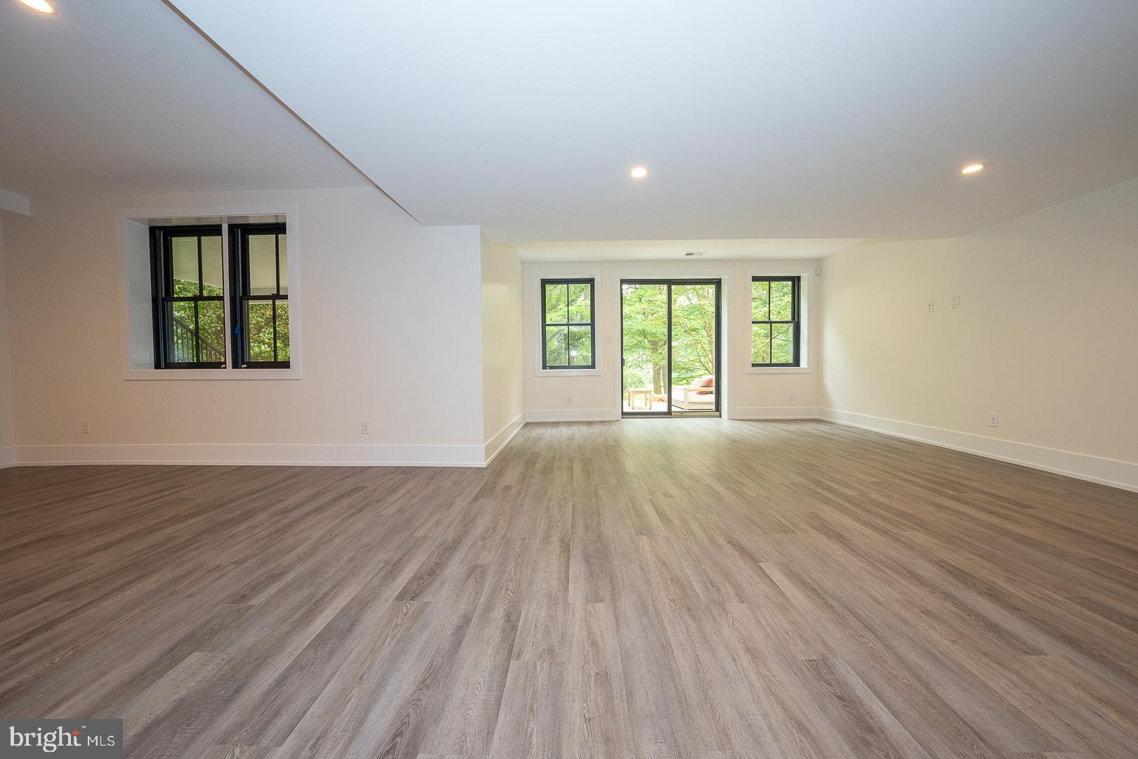 187 South Spring Mill Road Villanova, PA 19085 - Photo 46 of 53 an empty room with wooden floor and windows
