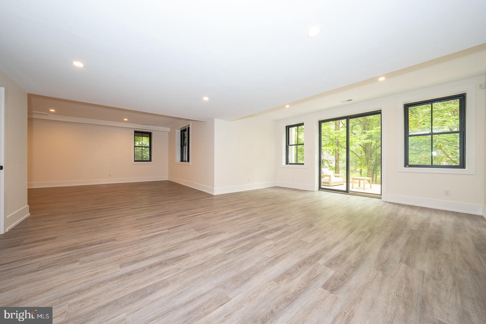 187 South Spring Mill Road Villanova, PA 19085 - Photo 47 of 53 an empty room with wooden floor and windows