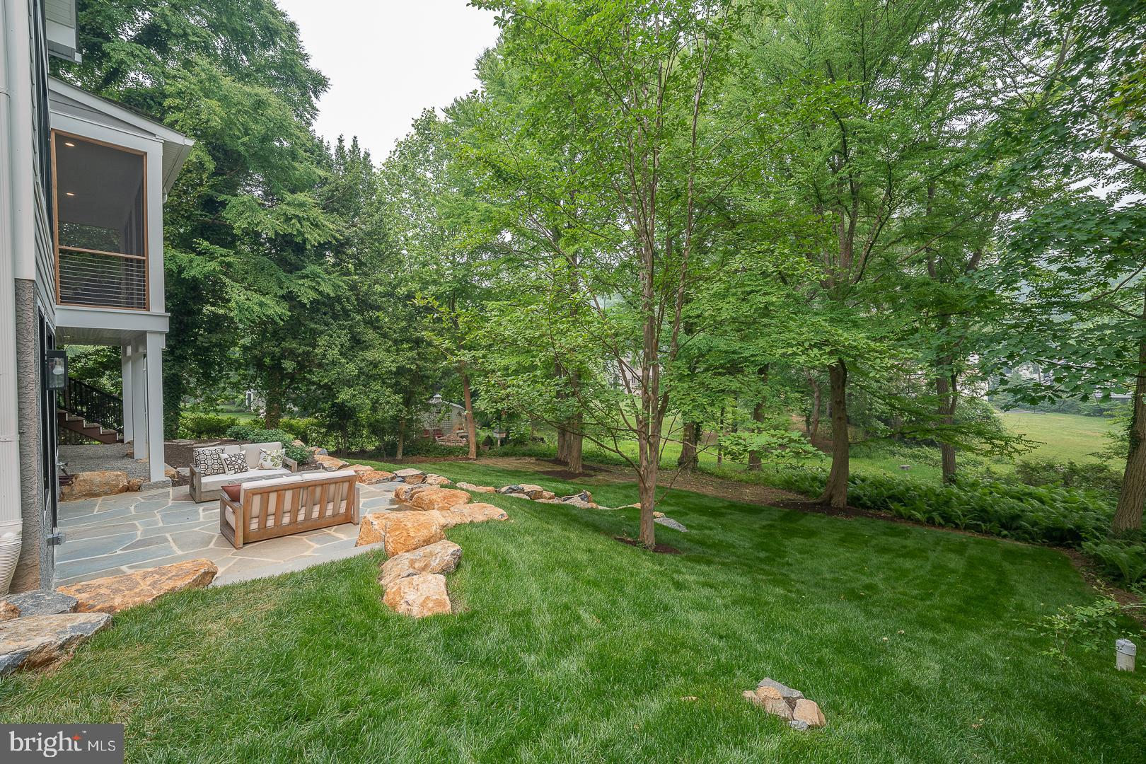 187 South Spring Mill Road Villanova, PA 19085 - Photo 50 of 53 a backyard of a house with table and chairs