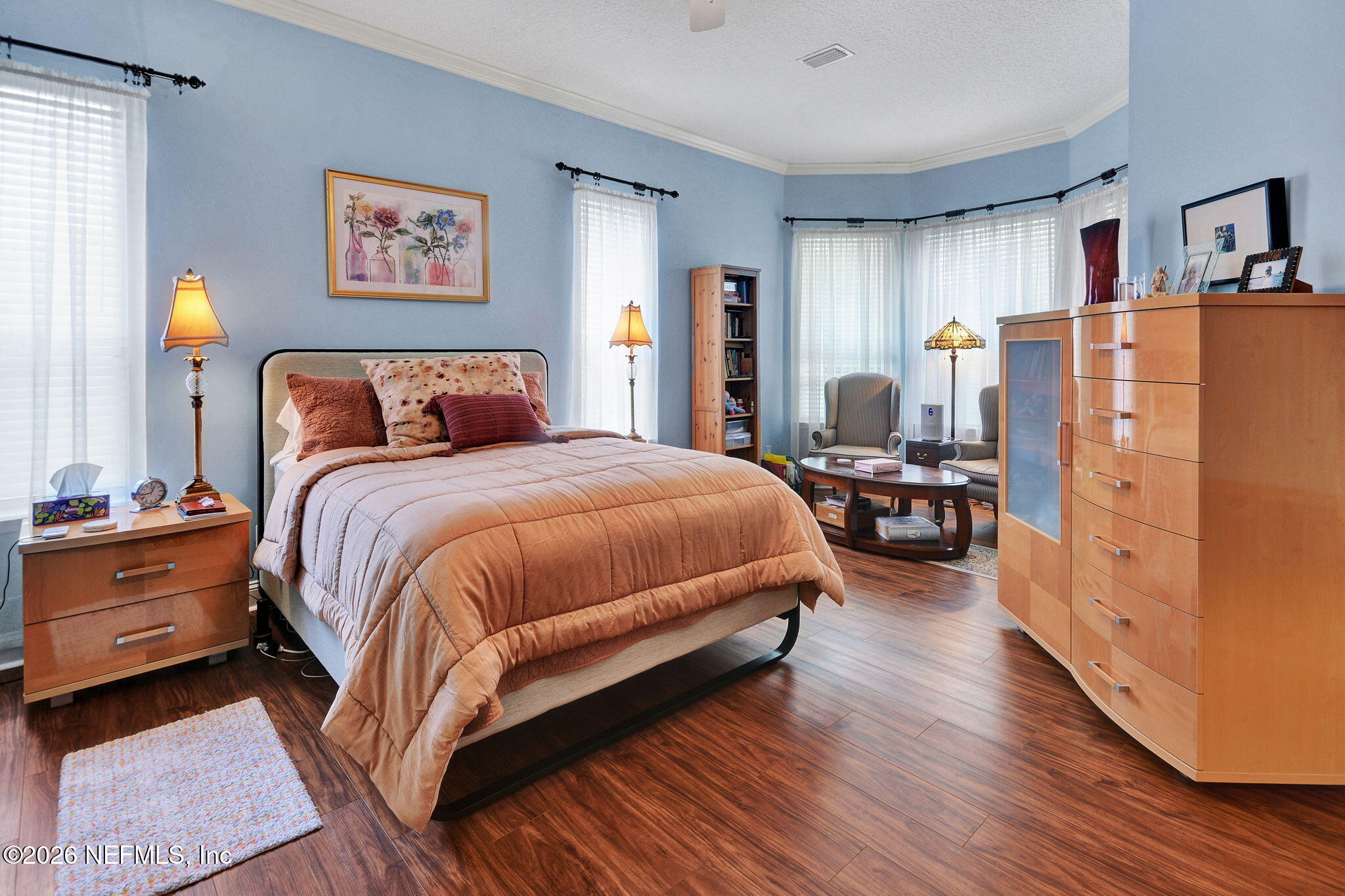 5950 West Shores Road Orange Park, FL 32003 - Photo 6 of 42 a bedroom with bed and a large mirror on the dresser