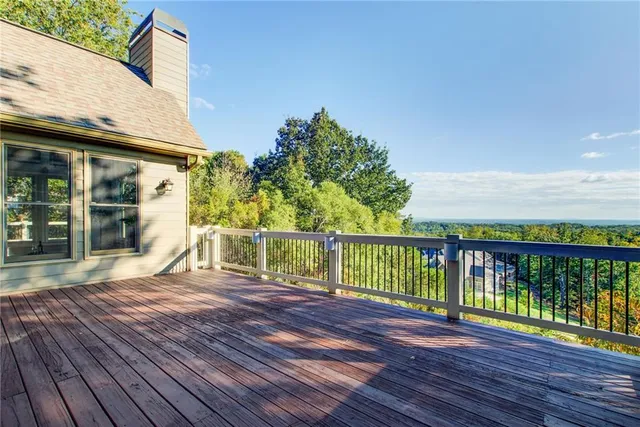 a bathroom with a shower a toilet and a window