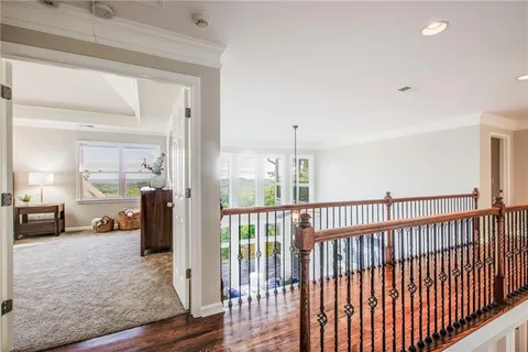 a kitchen with cabinets and chairs
