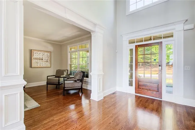 a kitchen with stainless steel appliances granite countertop a stove and a wooden floors