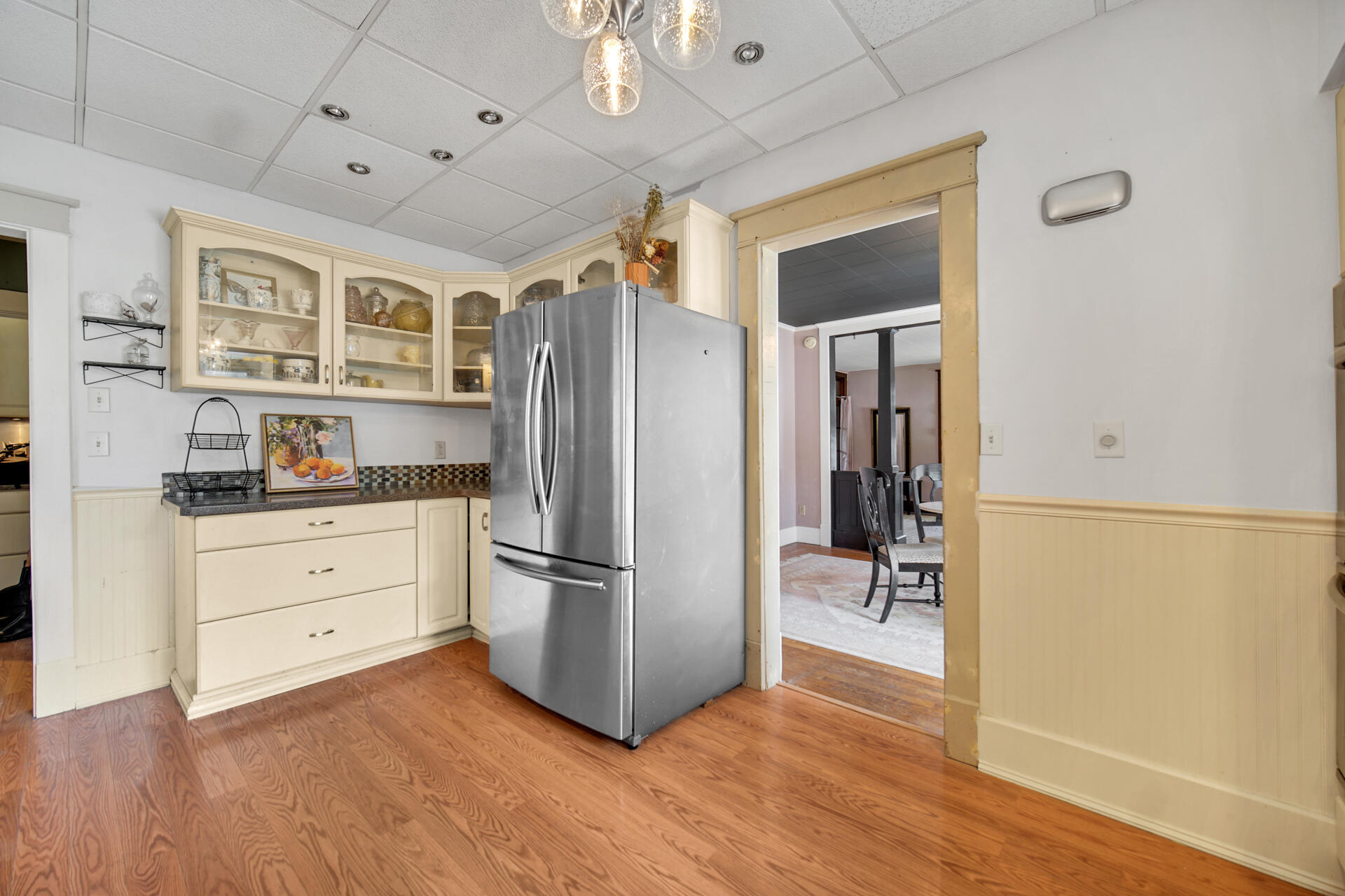1524 Monroe Street La Porte, IN 46350 - Photo 11 of 32 a kitchen with a refrigerator and a stove top oven