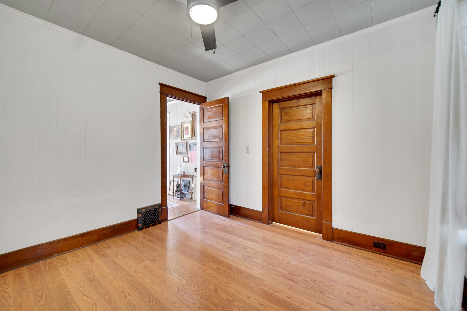 1524 Monroe Street La Porte, IN 46350 - Photo 13 of 32 an empty room with wooden floor closet and windows
