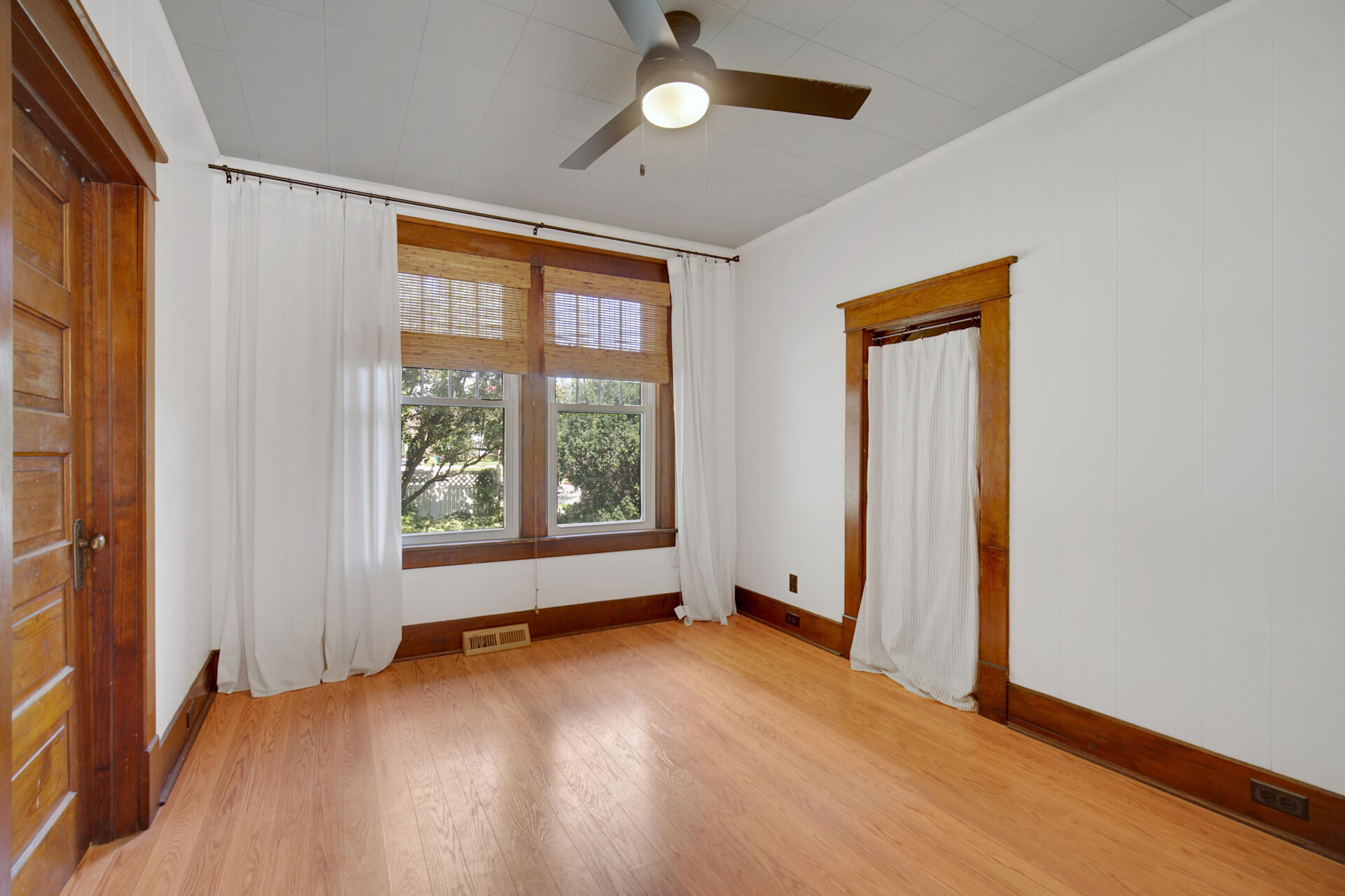 1524 Monroe Street La Porte, IN 46350 - Photo 14 of 32 an empty room with wooden floor and windows