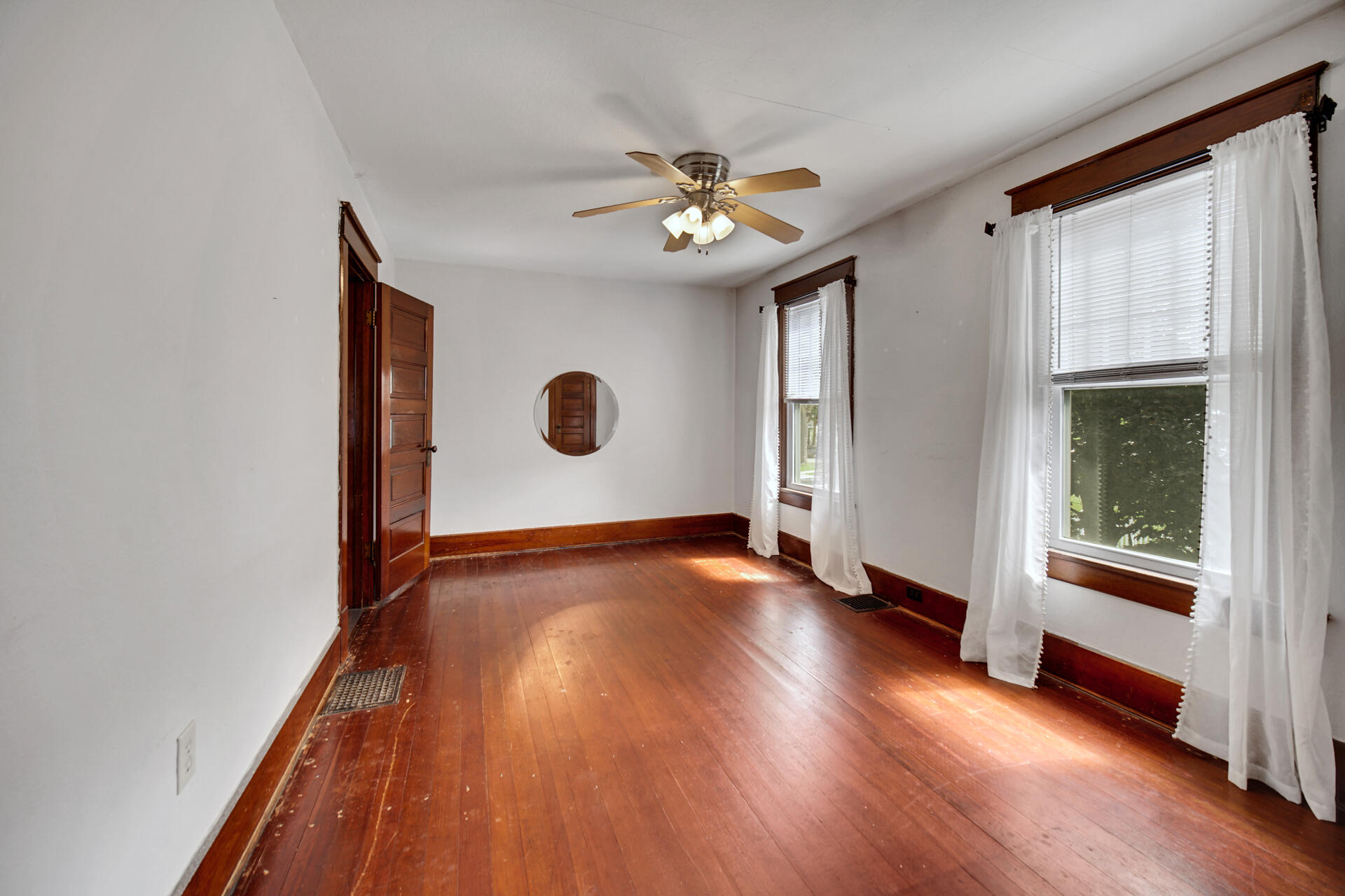 1524 Monroe Street La Porte, IN 46350 - Photo 20 of 32 a view of a livingroom with wooden floor and a window