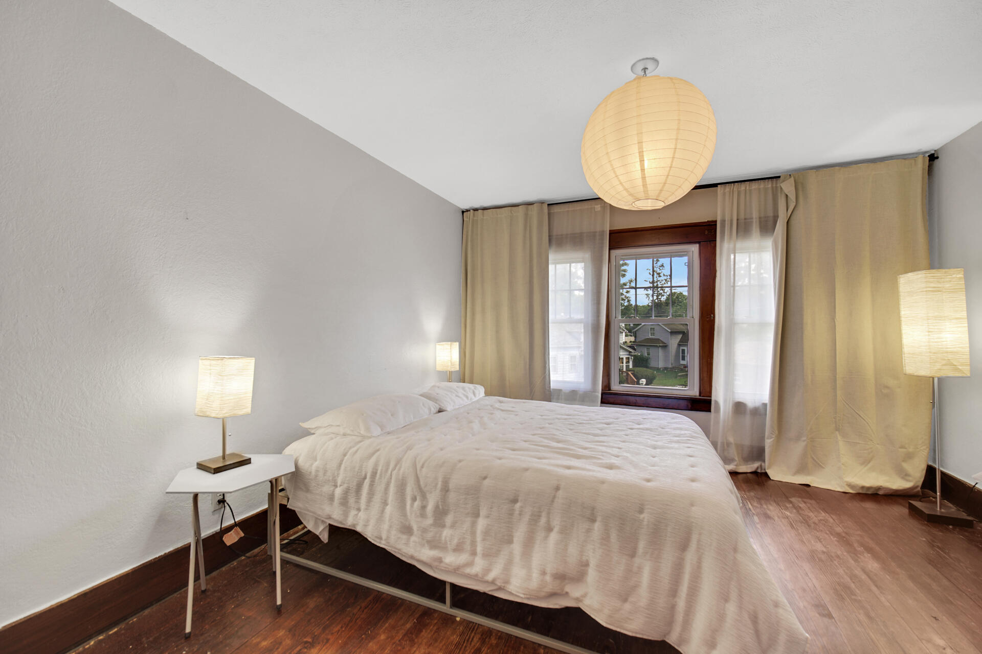 1524 Monroe Street La Porte, IN 46350 - Photo 23 of 32 a bedroom with a bed mirror and a window