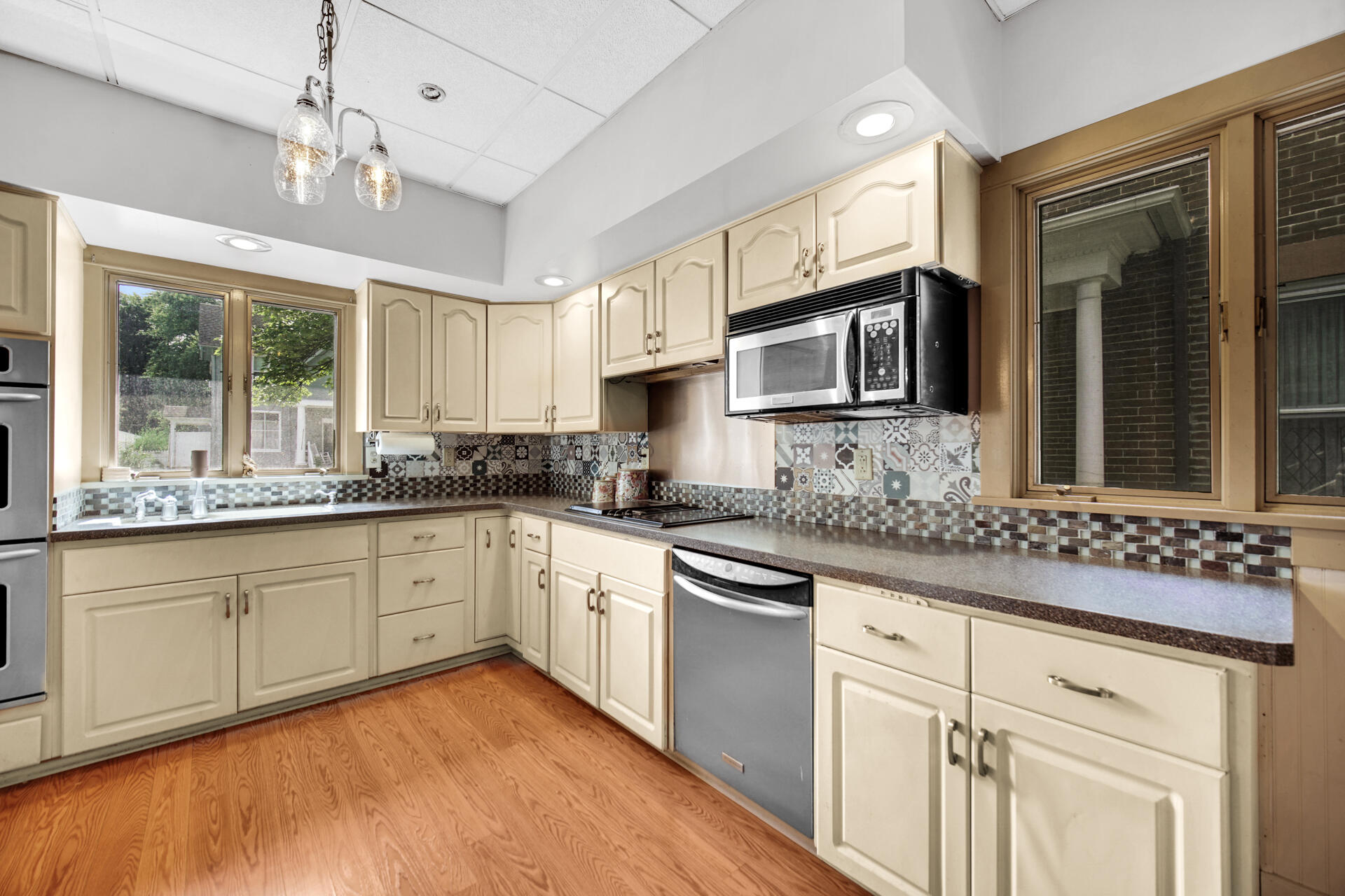1524 Monroe Street La Porte, IN 46350 - Photo 10 of 32 a kitchen with stainless steel appliances granite countertop a sink and microwave