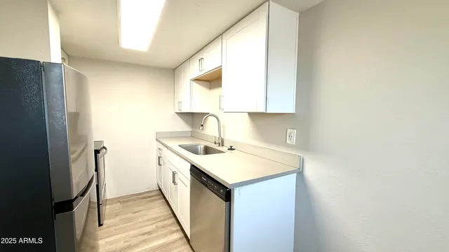 a view of a kitchen from the hallway