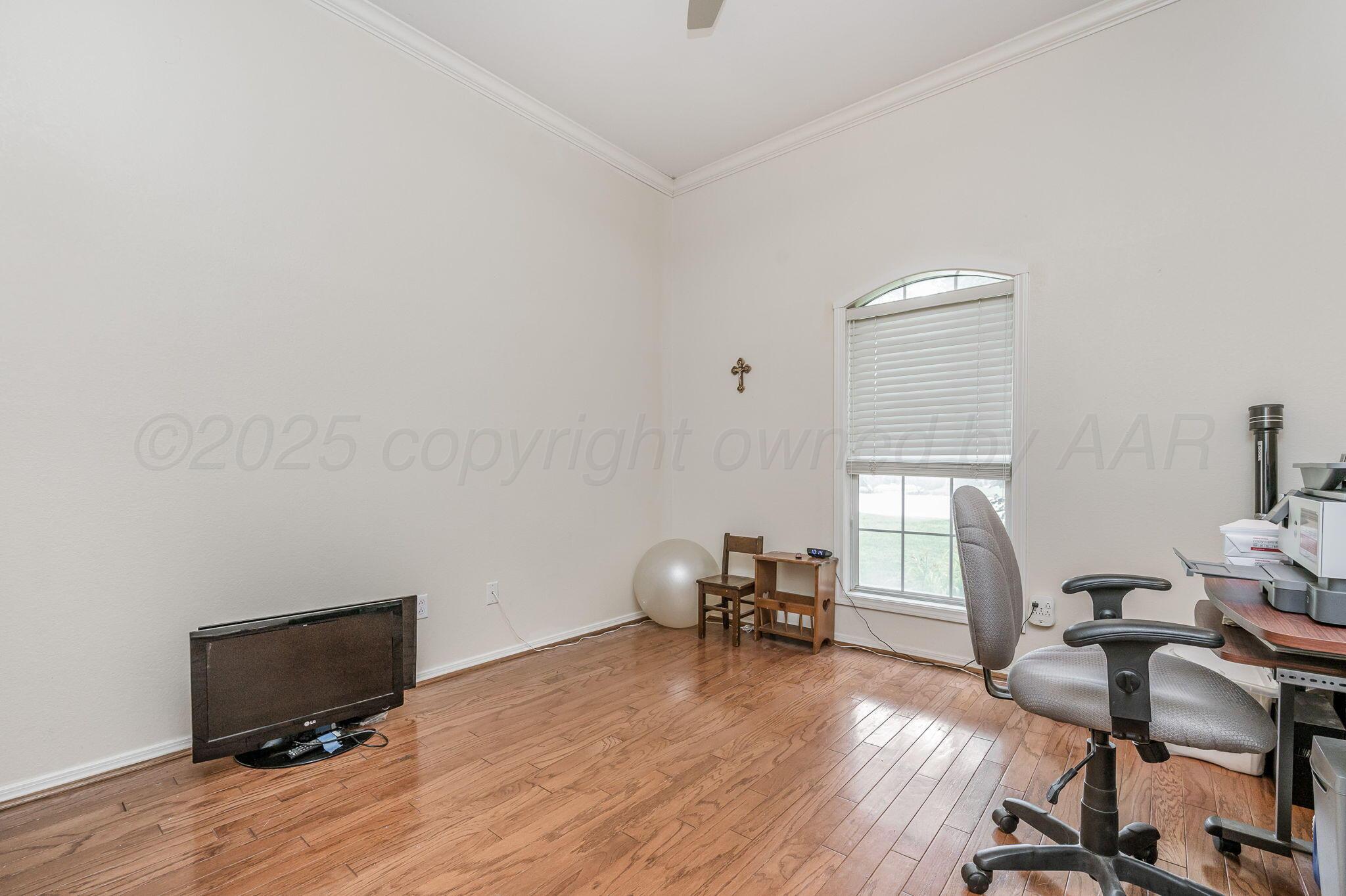 7809 Bent Tree Drive Amarillo, TX 79121 - Photo 17 of 31 a workspace with furniture and a window