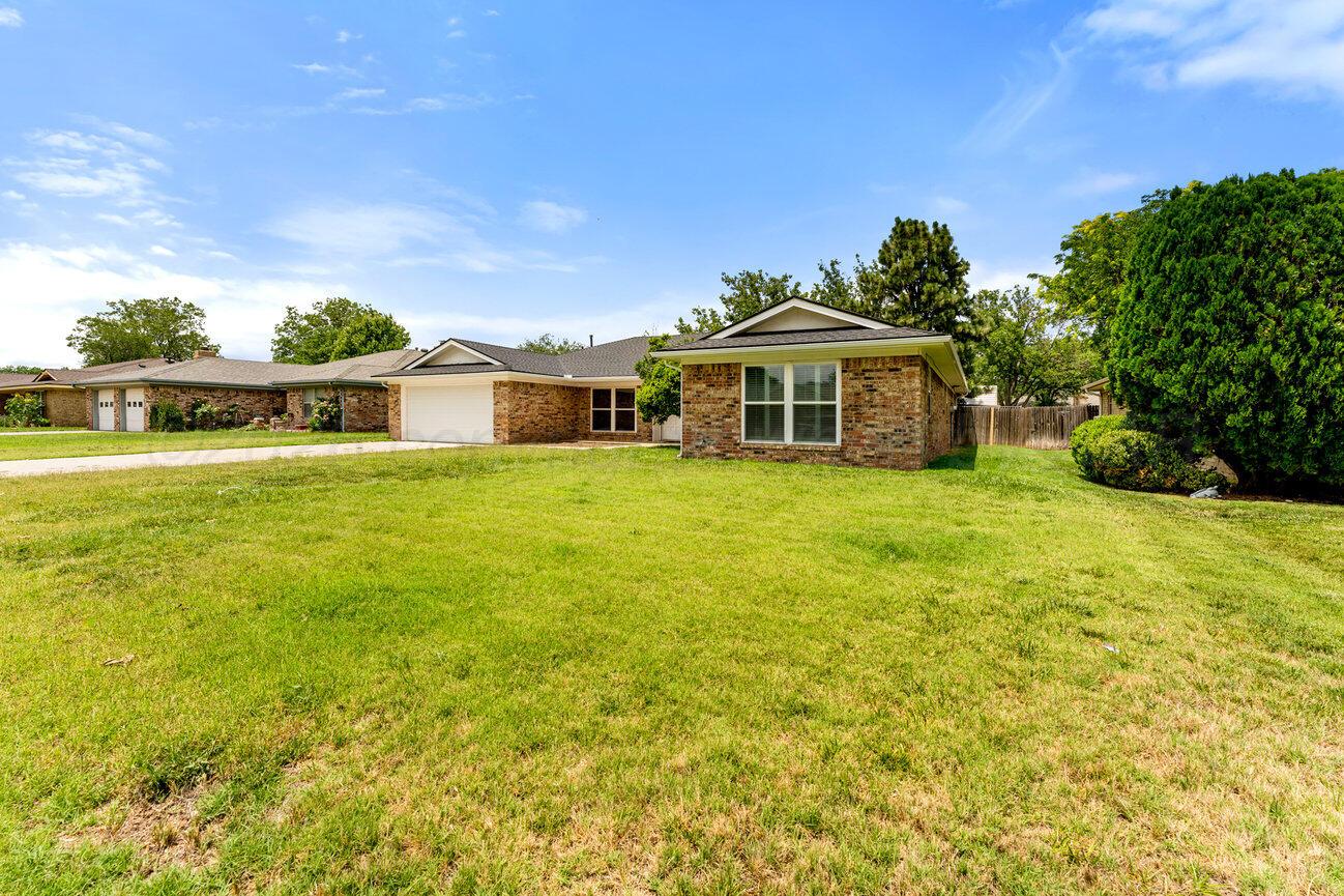 7204 Southwest 39th Avenue Amarillo, TX 79109 - Photo 3 of 51 a view of a house with a big yard and potted plants