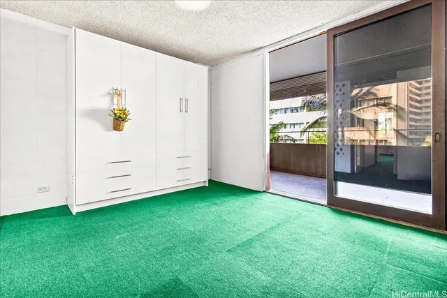 a view of an empty room with a fireplace