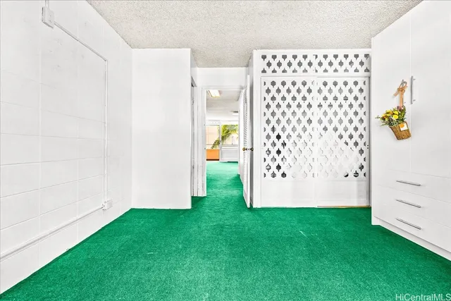 a bathroom with a granite countertop sink a toilet and a mirror