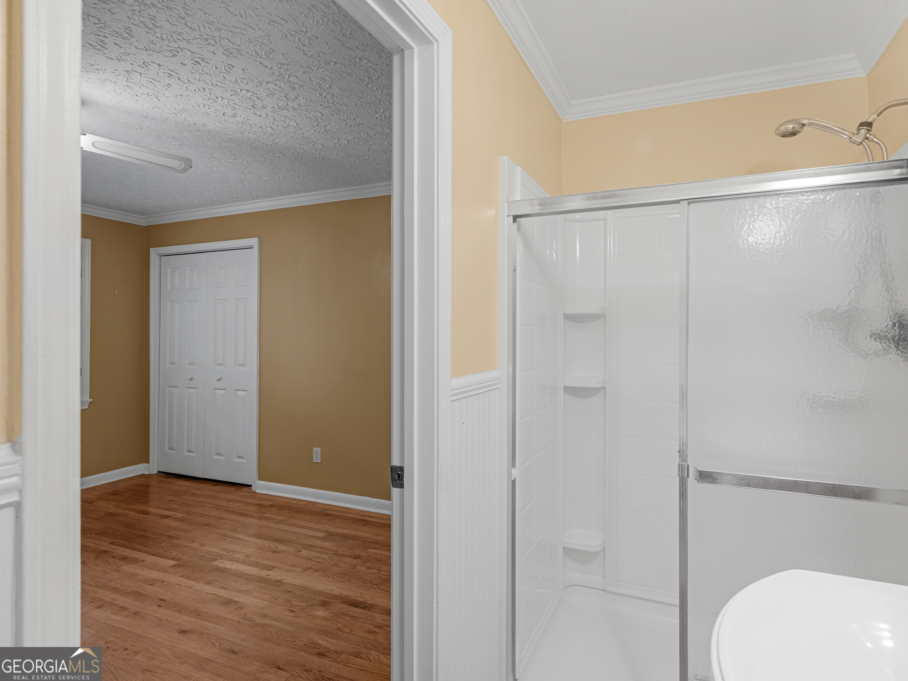 105 Zebulon Street Milner, GA 30257 - Photo 16 of 34 a bathroom with a shower and a toilet