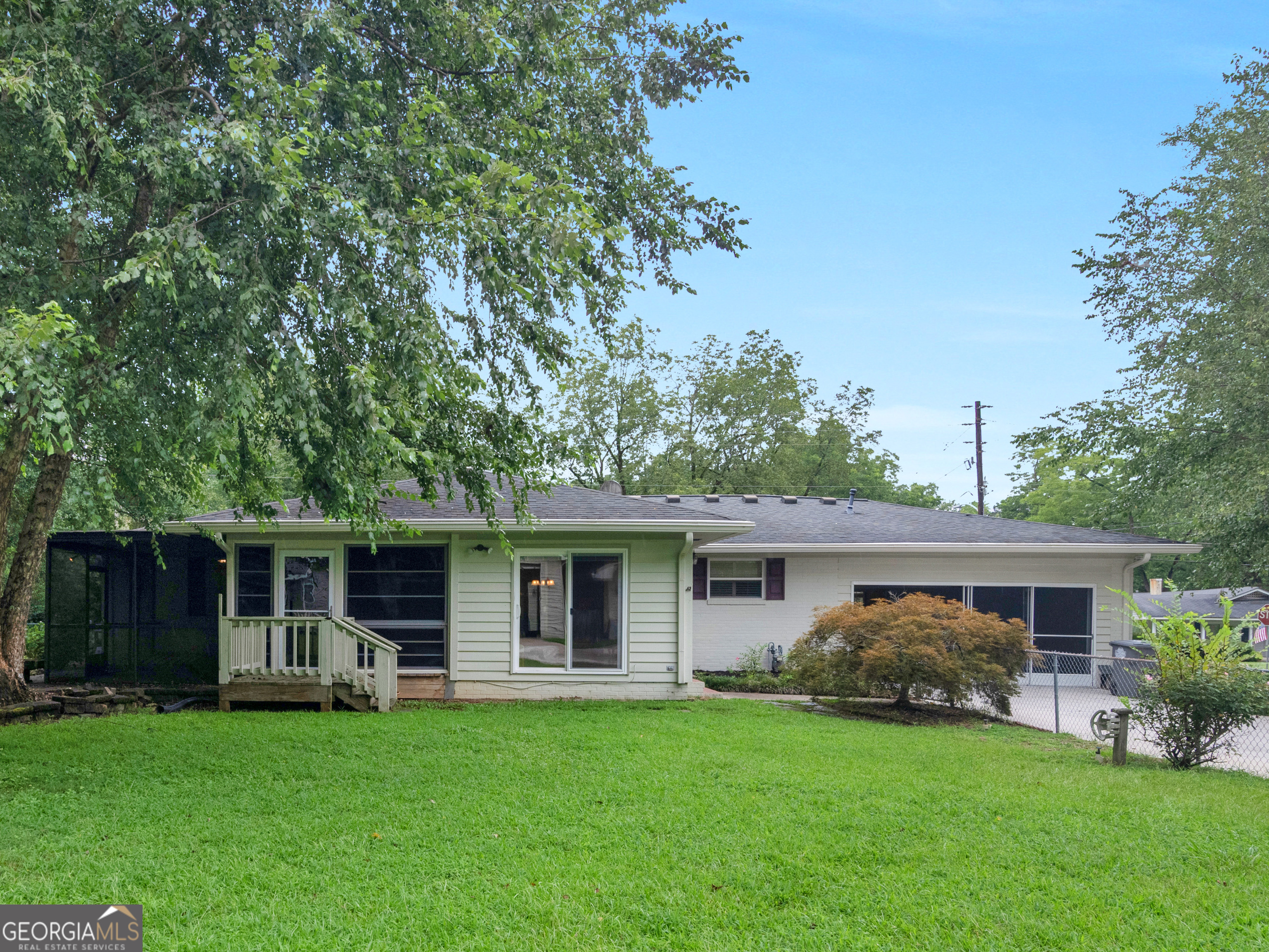 105 Zebulon Street Milner, GA 30257 - Photo 2 of 34 a front view of a house with a garden and porch