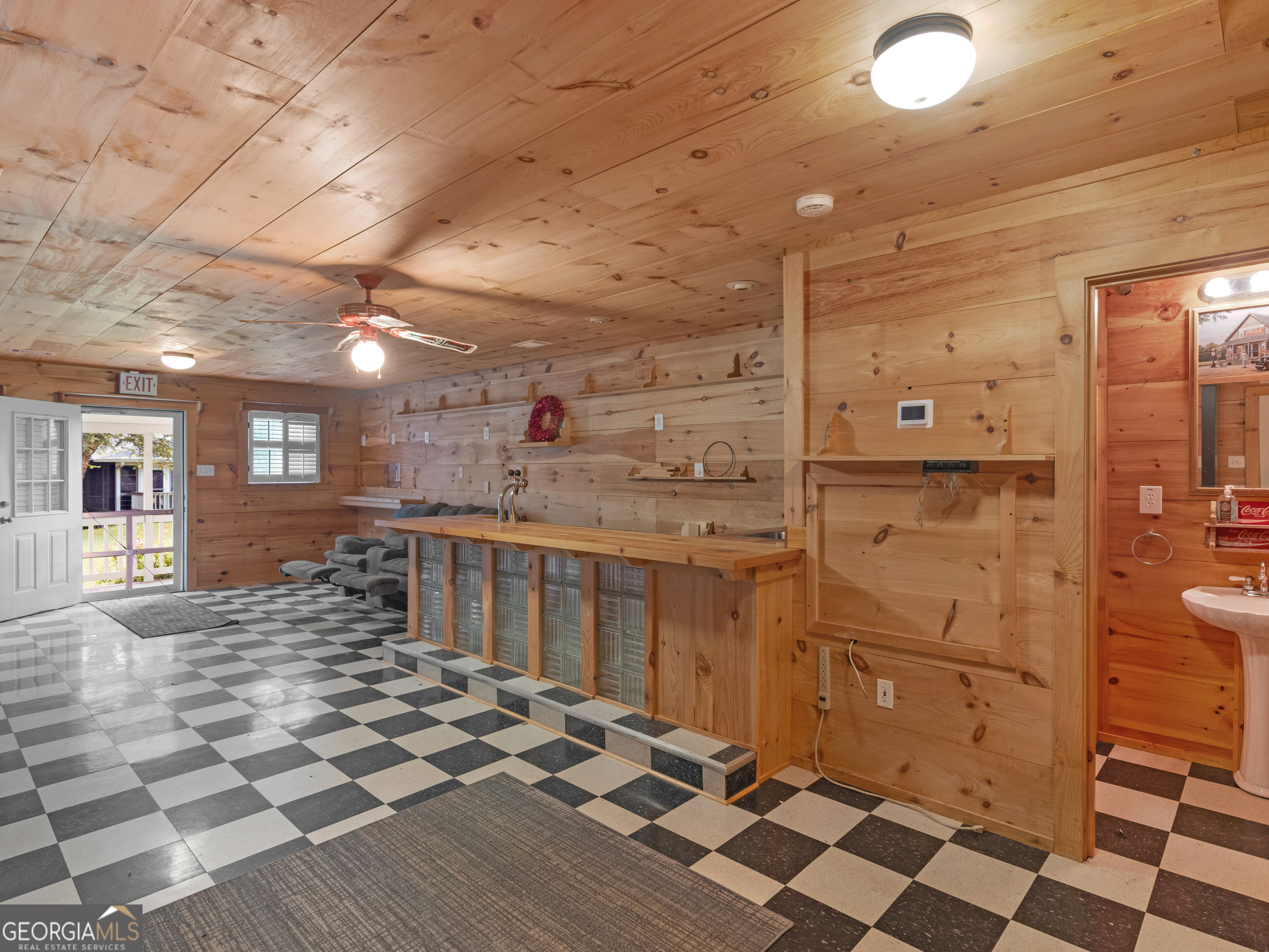 105 Zebulon Street Milner, GA 30257 - Photo 28 of 34 a bathroom with a sink and a mirror
