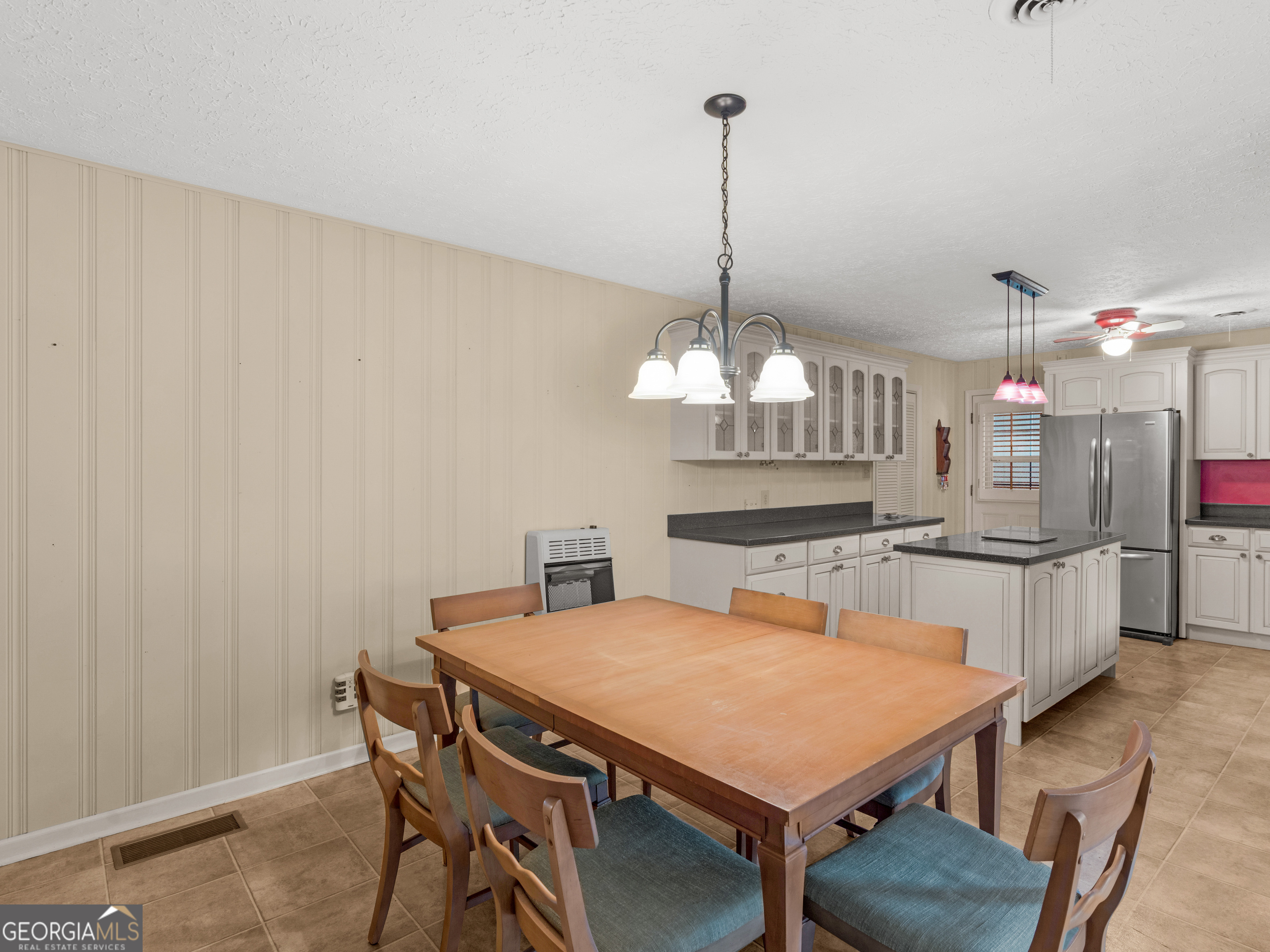 105 Zebulon Street Milner, GA 30257 - Photo 5 of 34 a view of a dining room with furniture and chandelier