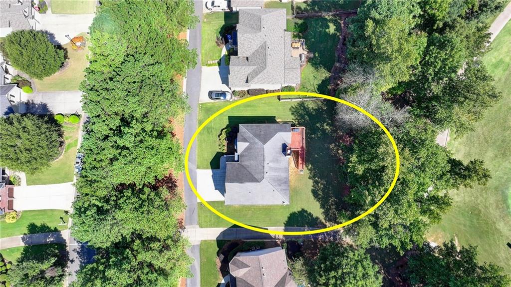 6415 Hampton Rock Lane Cumming, GA 30041 - Photo 19 of 26 an aerial view of a house with a swimming pool