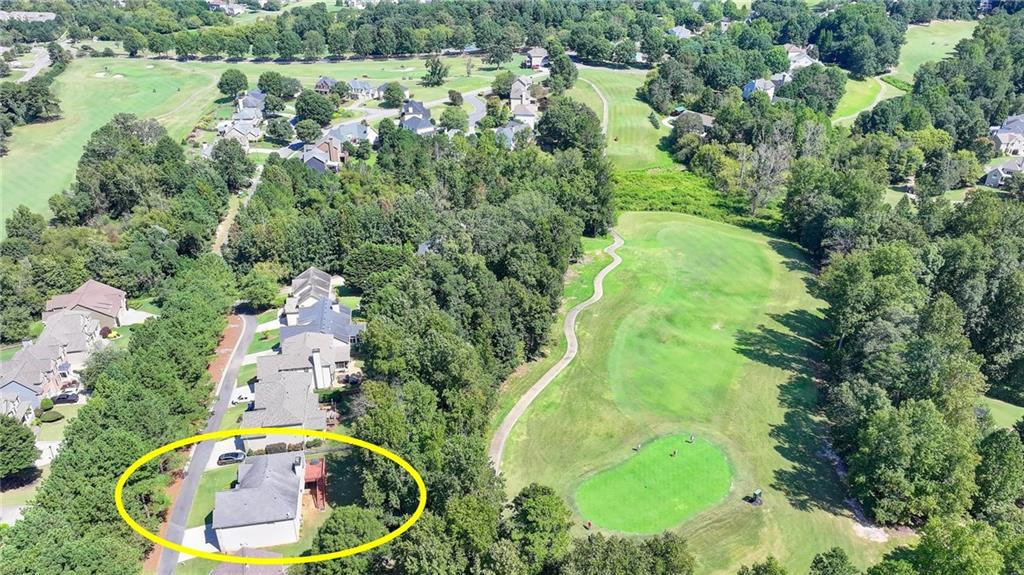 6415 Hampton Rock Lane Cumming, GA 30041 - Photo 20 of 26 an aerial view of residential houses with outdoor space and trees