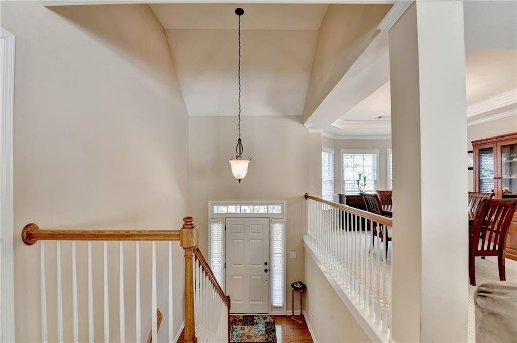 6415 Hampton Rock Lane Cumming, GA 30041 - Photo 2 of 26 a view of staircase with railing and white walls
