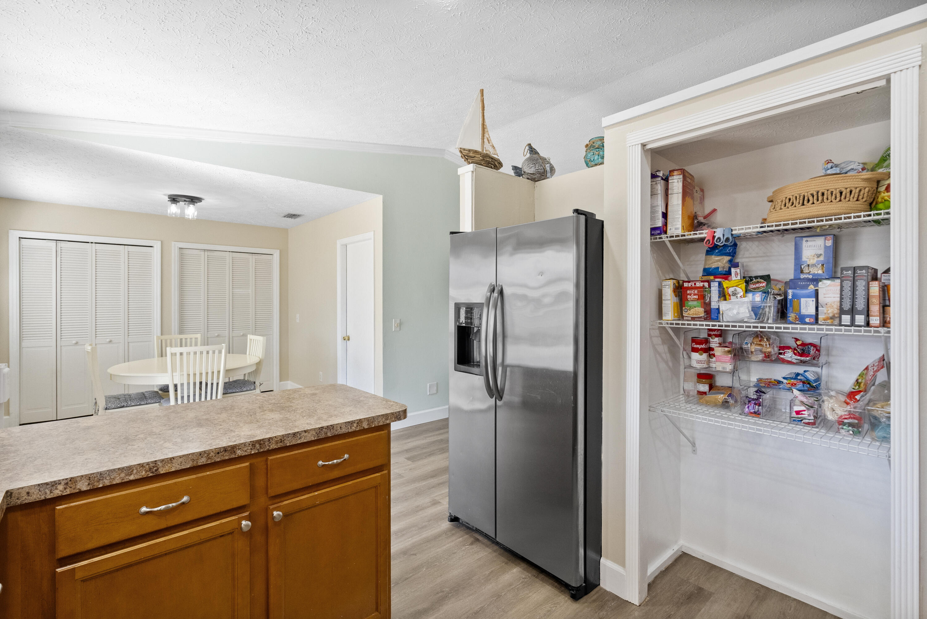 822 Southwest Harvard Road Port St. Lucie, FL 34953 - Photo 15 of 43 a kitchen with stainless steel appliances granite countertop a refrigerator and a sink