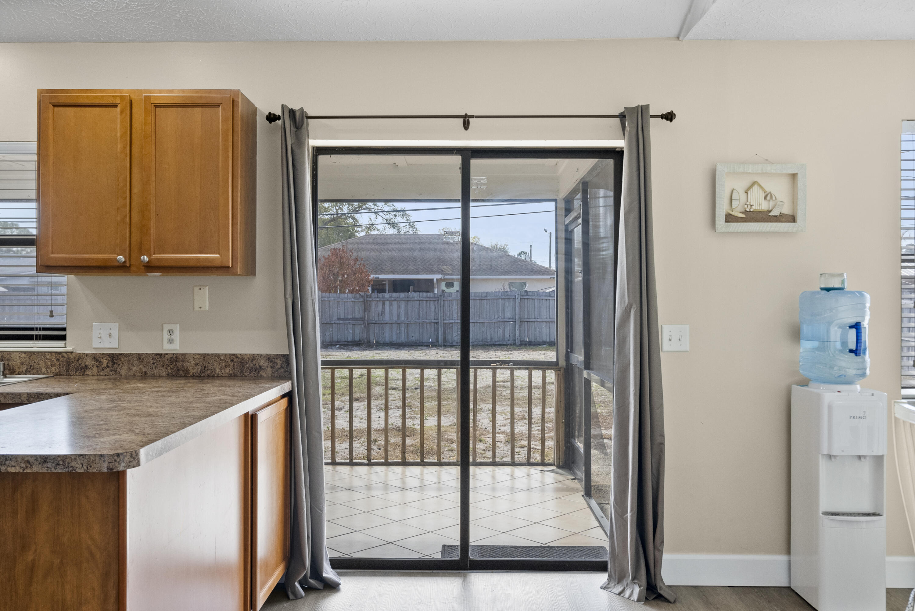822 Southwest Harvard Road Port St. Lucie, FL 34953 - Photo 16 of 43 a kitchen with a sink and a window