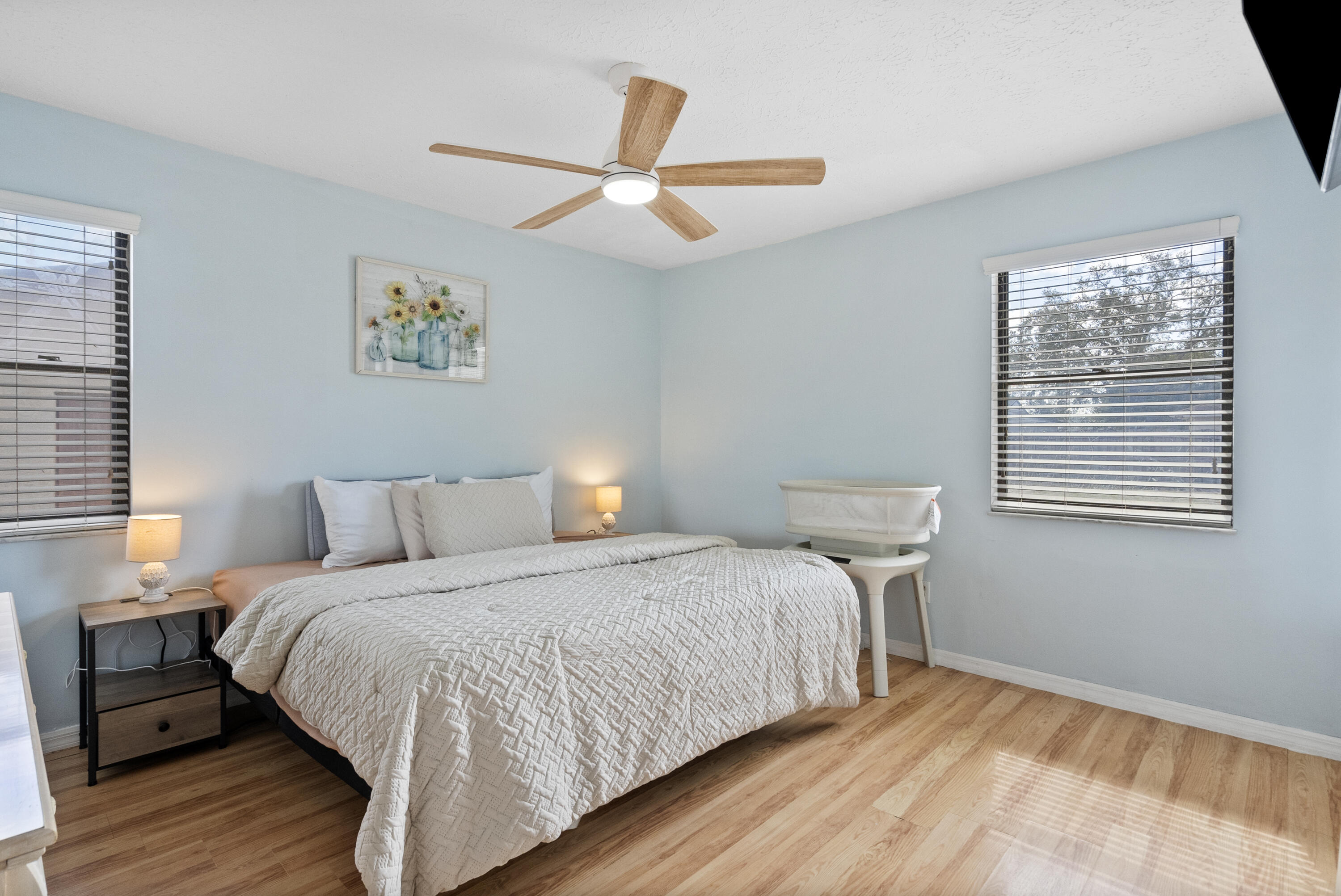 822 Southwest Harvard Road Port St. Lucie, FL 34953 - Photo 19 of 43 a bedroom with a bed and a window