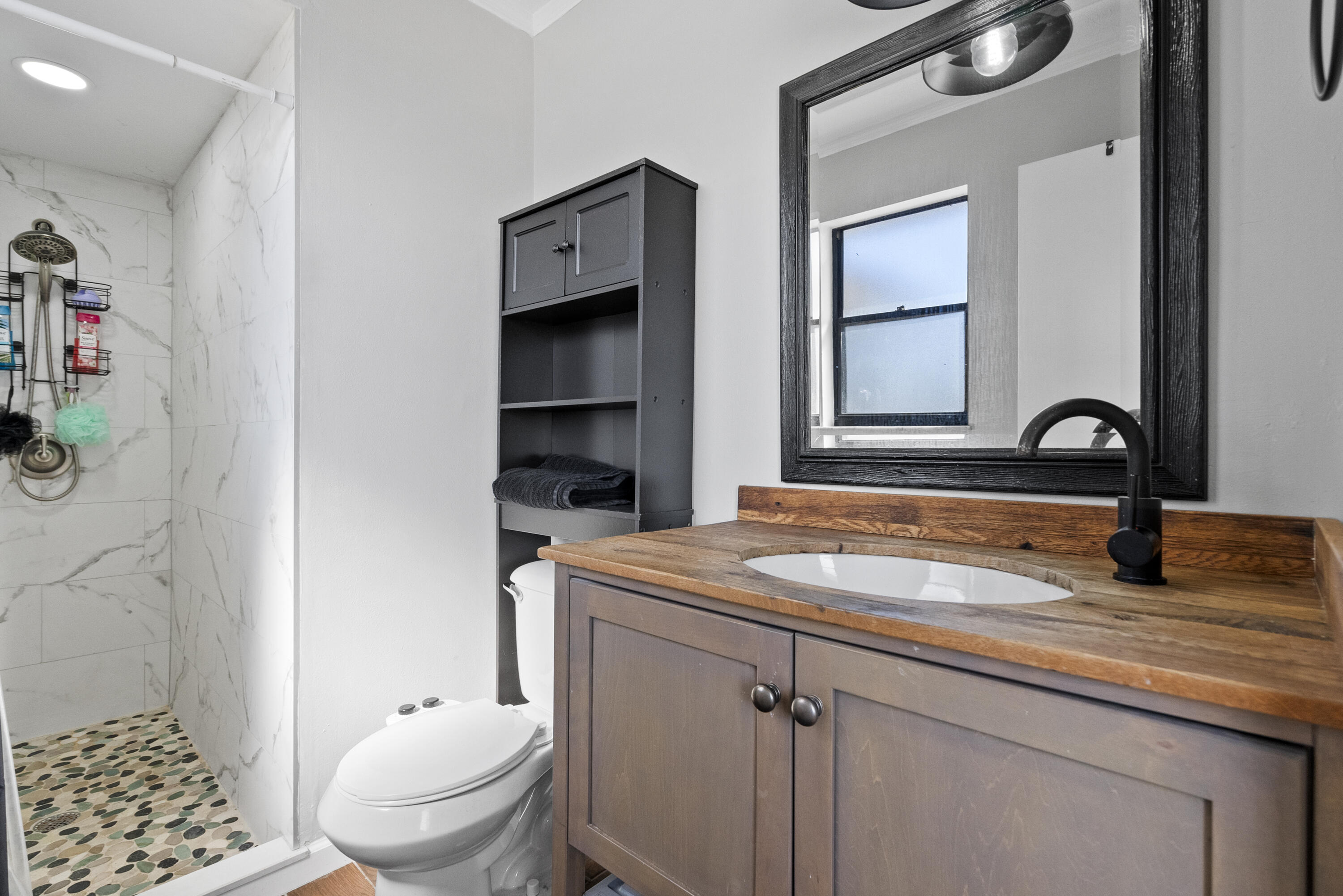 822 Southwest Harvard Road Port St. Lucie, FL 34953 - Photo 22 of 43 a bathroom with a granite countertop sink toilet and shower