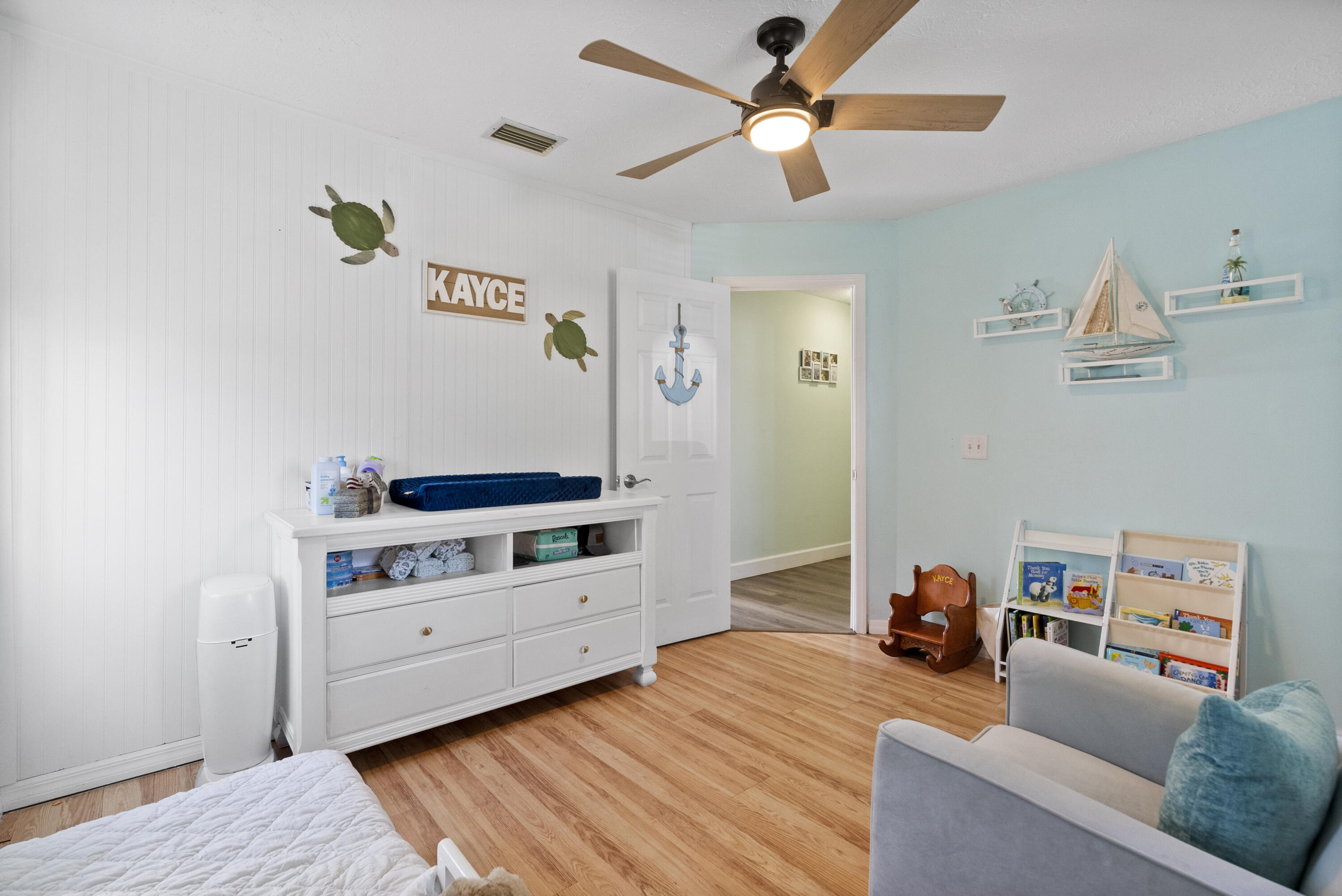 822 Southwest Harvard Road Port St. Lucie, FL 34953 - Photo 24 of 43 a bedroom with furniture and a chandelier fan