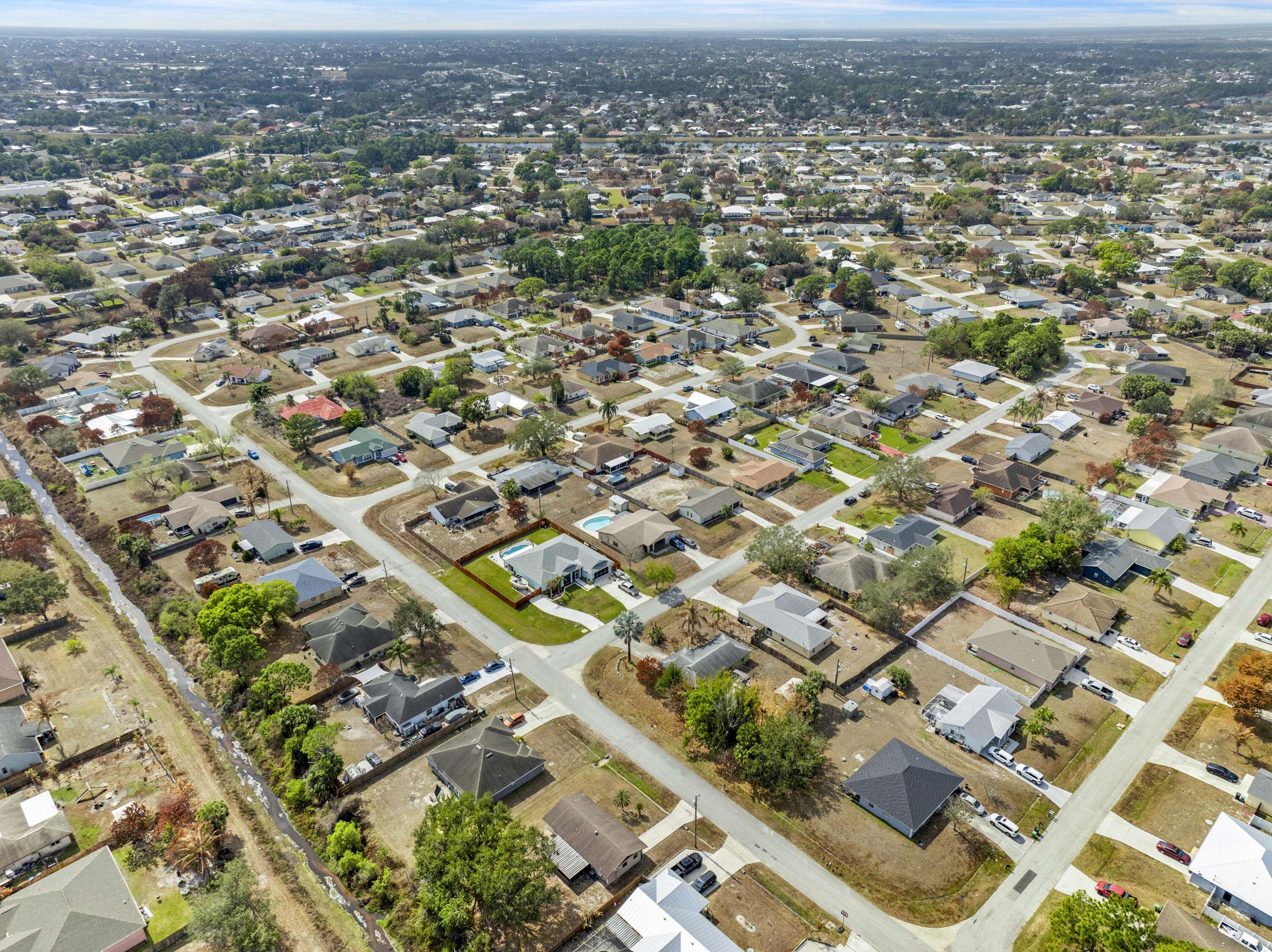 822 Southwest Harvard Road Port St. Lucie, FL 34953 - Photo 28 of 43 an aerial view of residential houses with city view