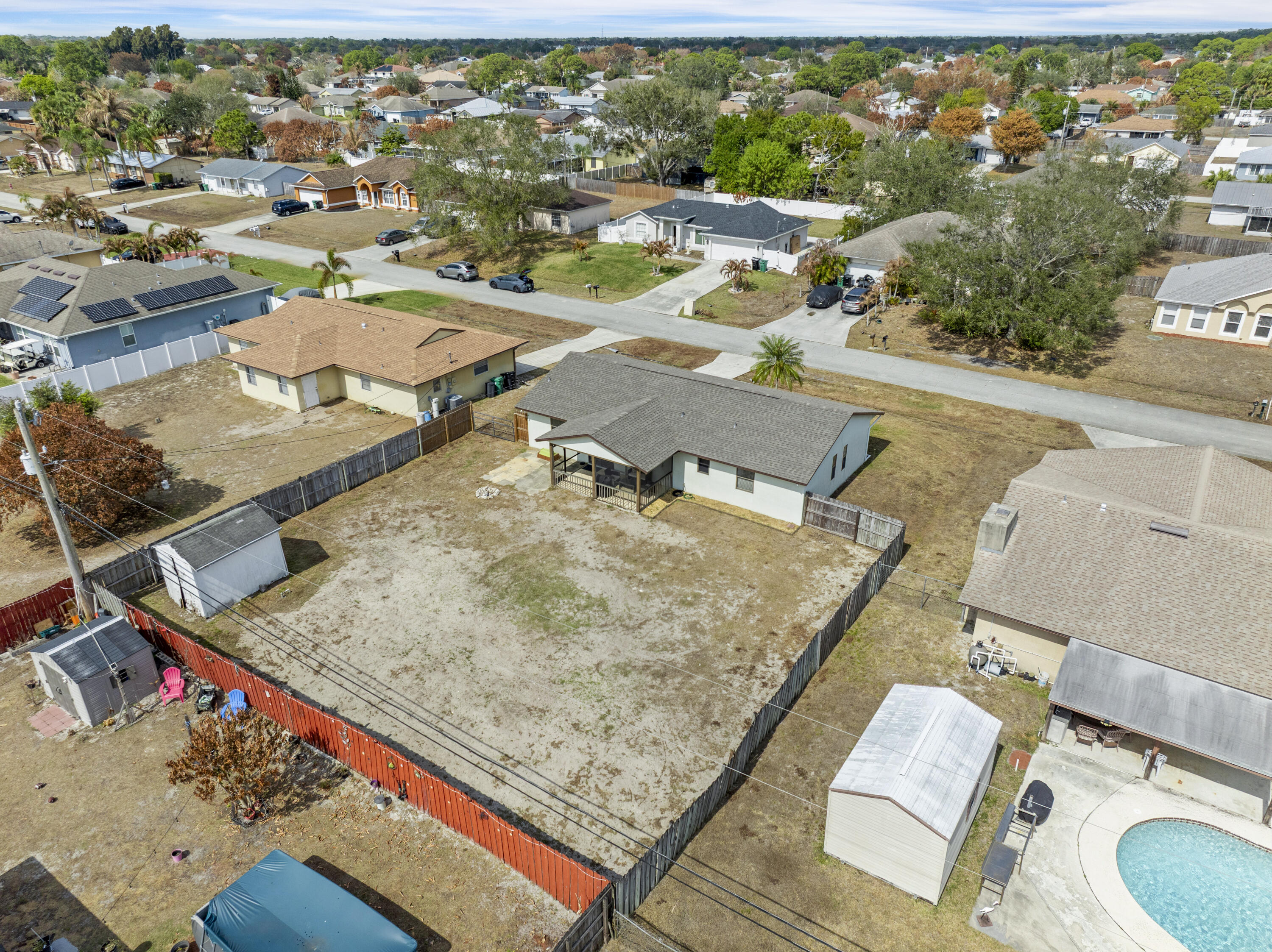 822 Southwest Harvard Road Port St. Lucie, FL 34953 - Photo 29 of 43 an aerial view of residential houses with outdoor space
