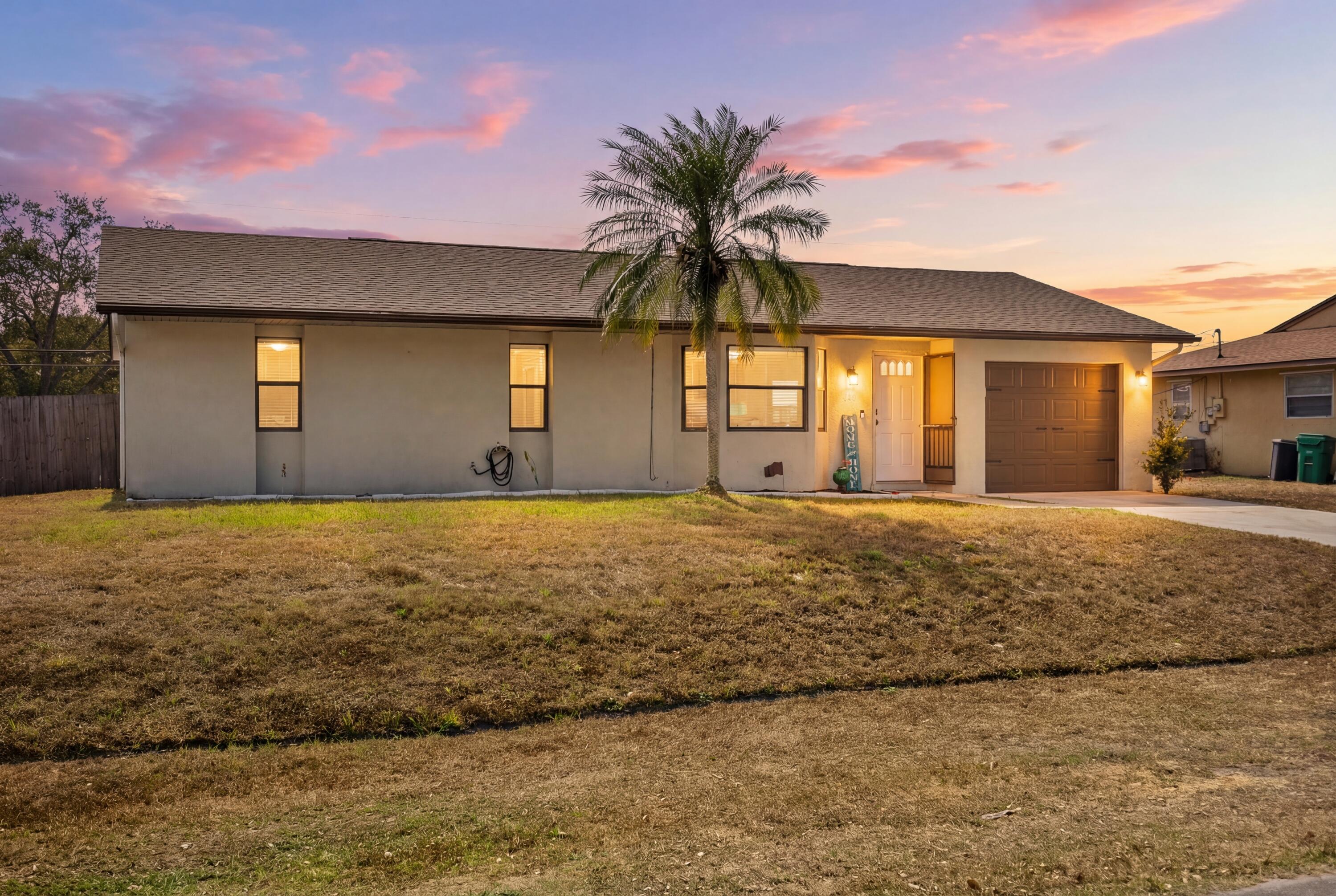 822 Southwest Harvard Road Port St. Lucie, FL 34953 - Photo 41 of 43 a front view of house with yard