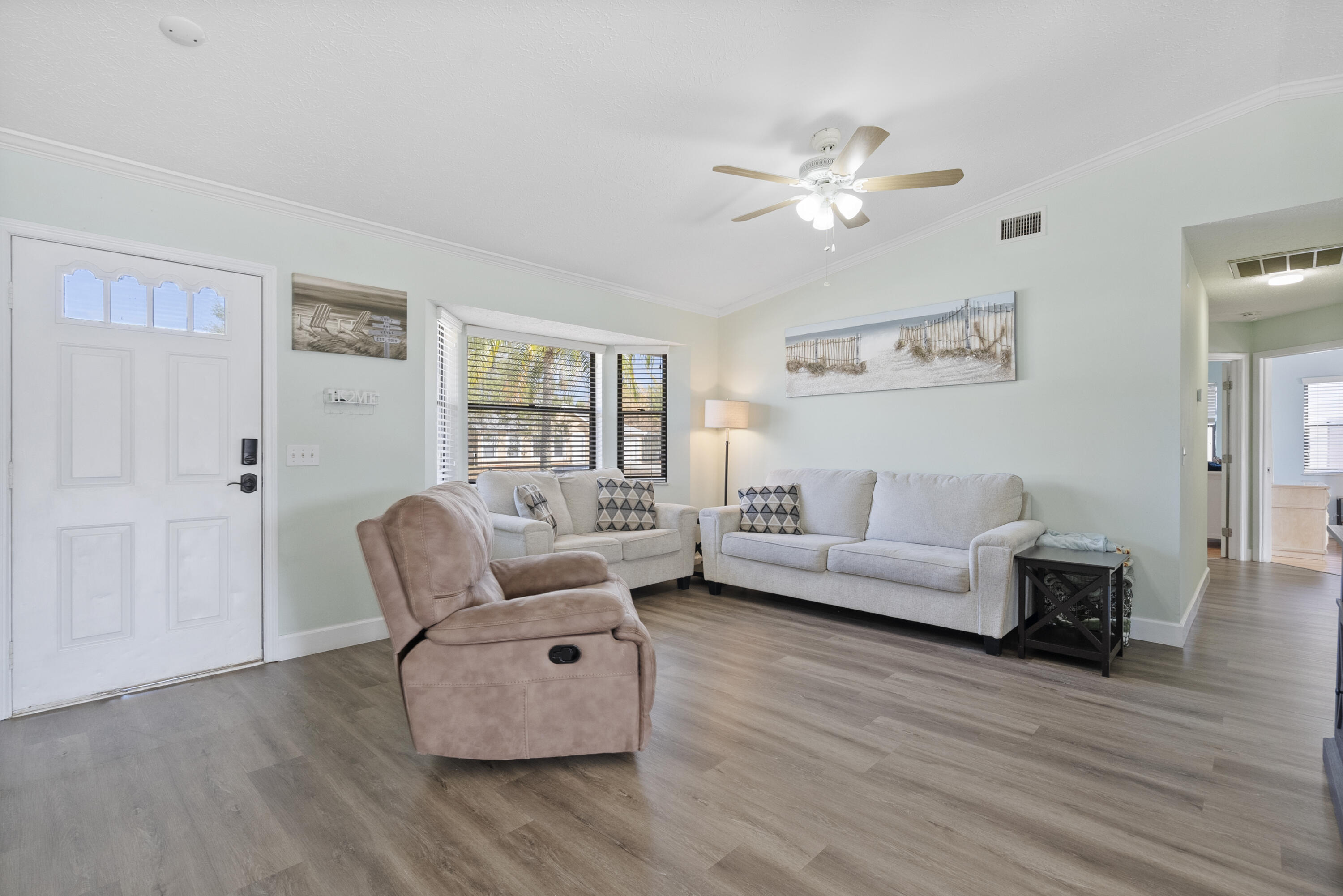 822 Southwest Harvard Road Port St. Lucie, FL 34953 - Photo 6 of 43 a living room with furniture and a wooden floor